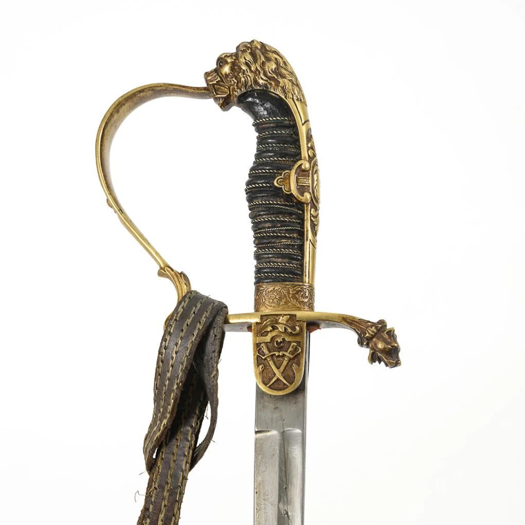 Officer's "Löwenkopf" saber with scabbard and sword knot.