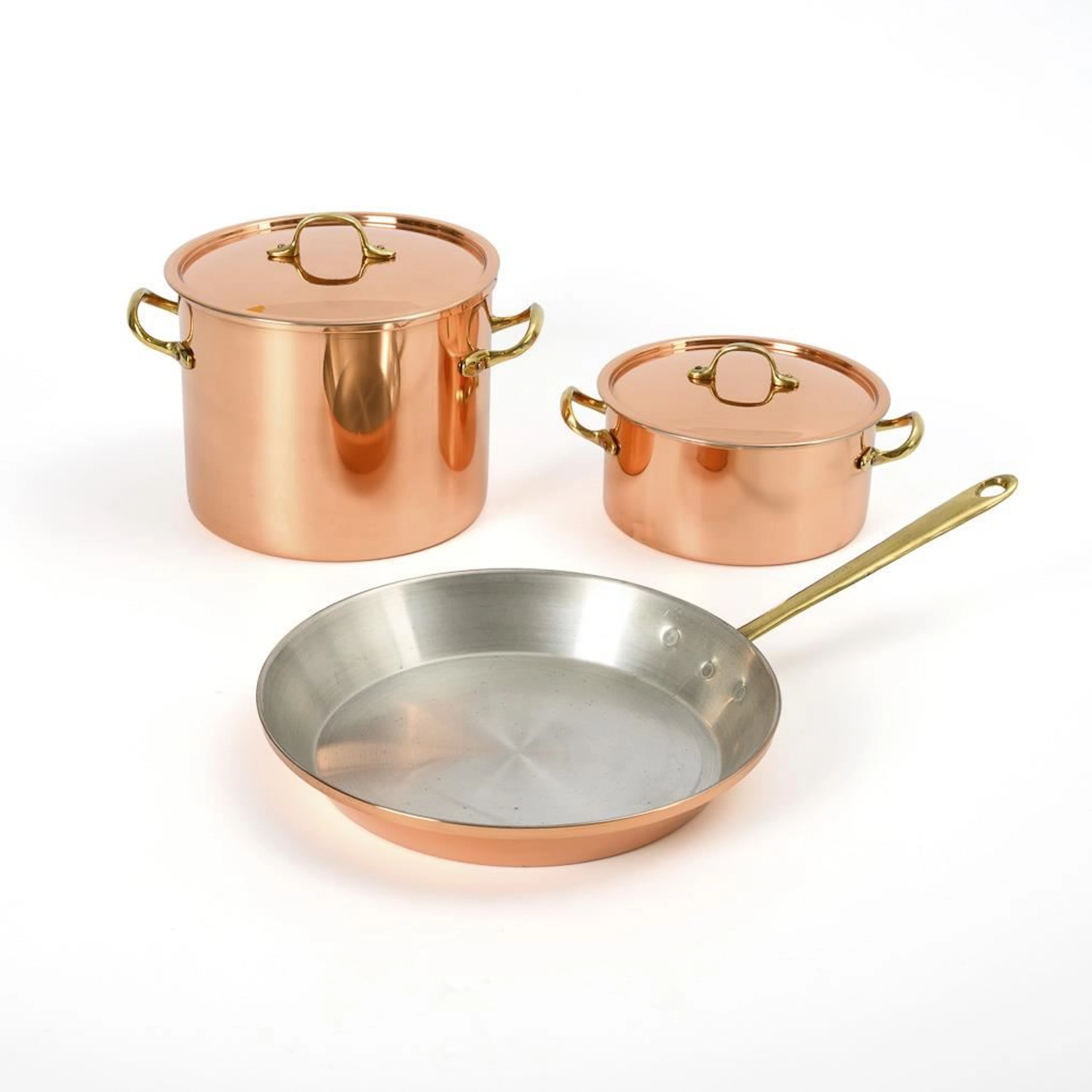 2 copper pots and a copper pan.