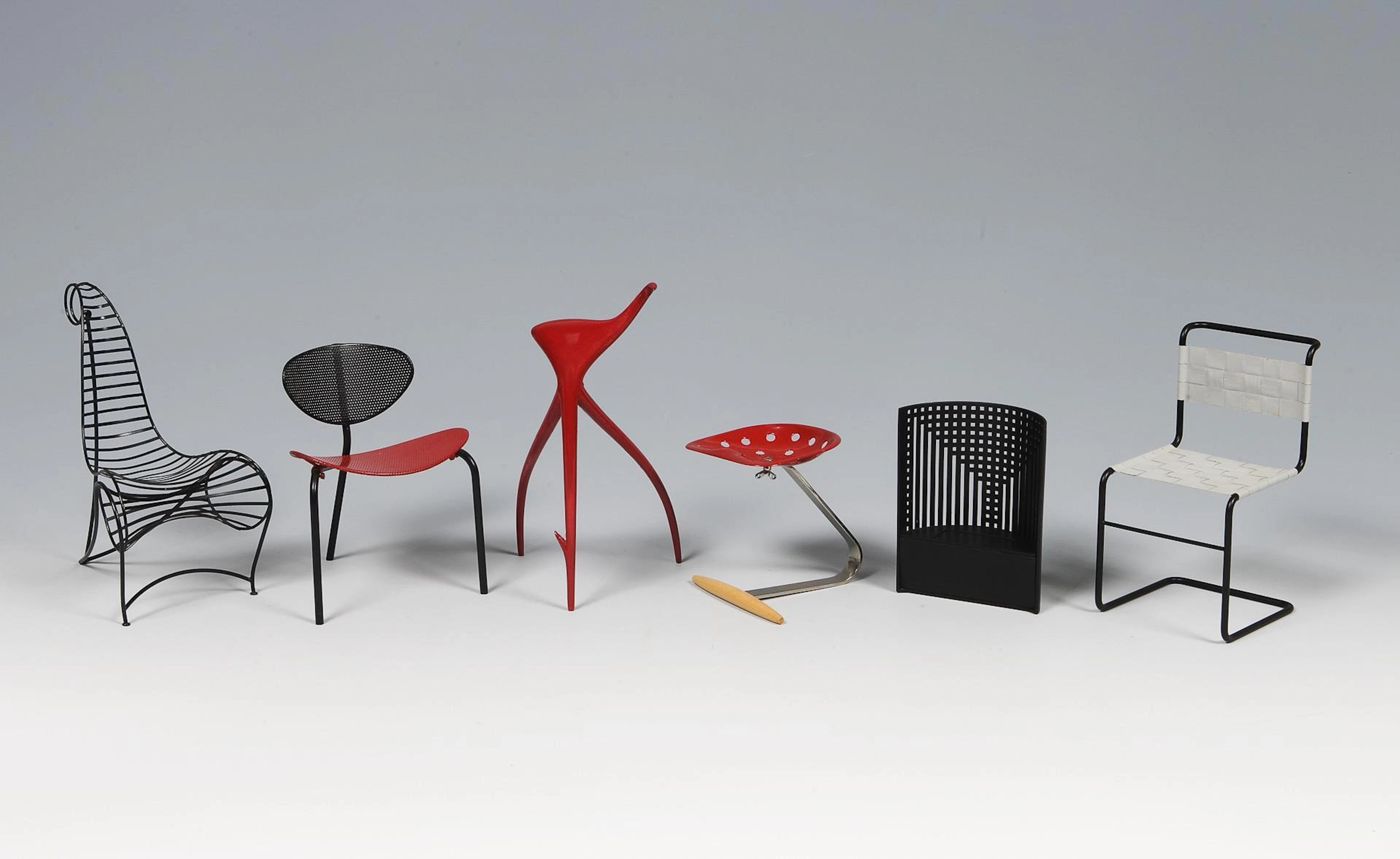 6 miniature design chairs.