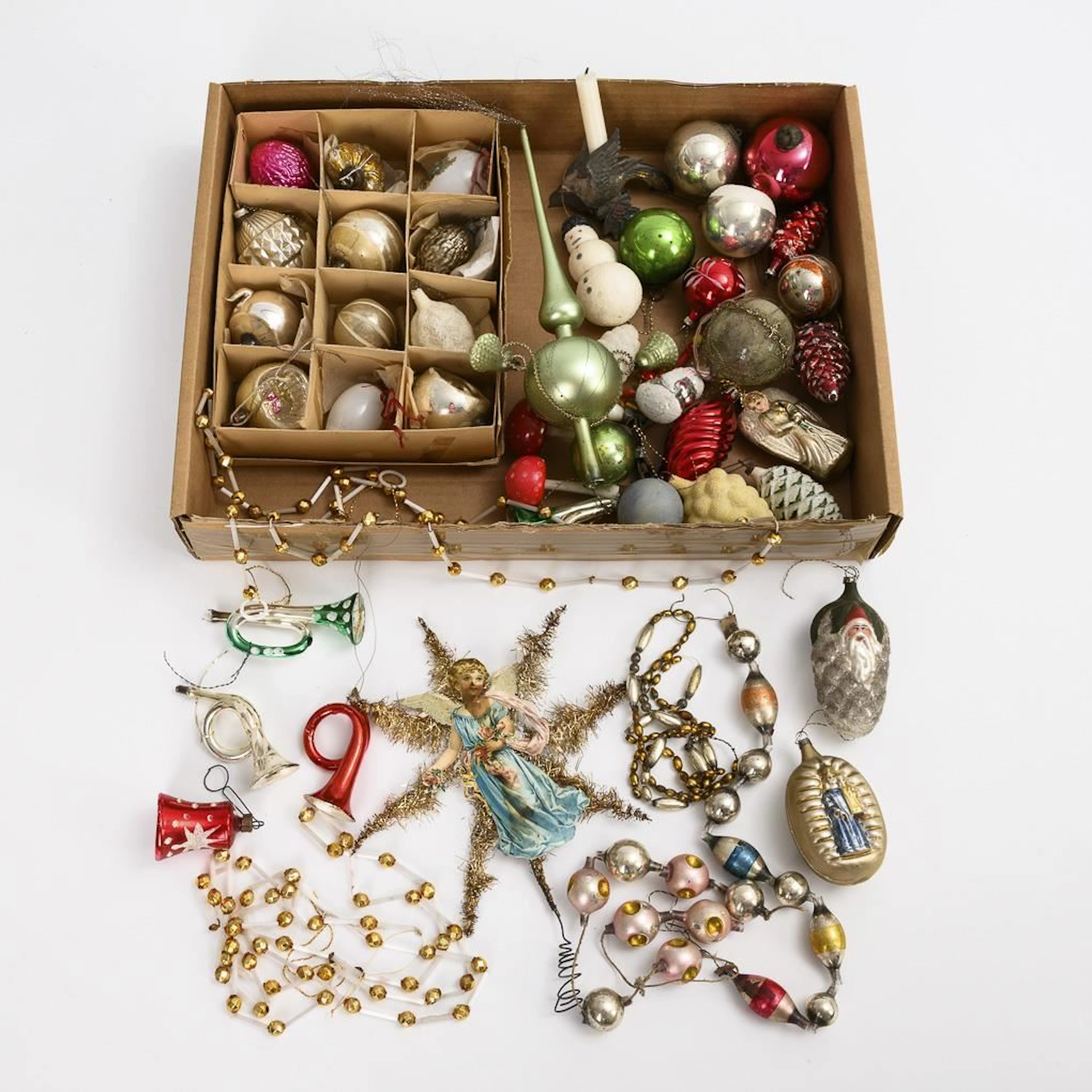 Assortment of Christmas tree ornaments with chains and 2 lace pieces.