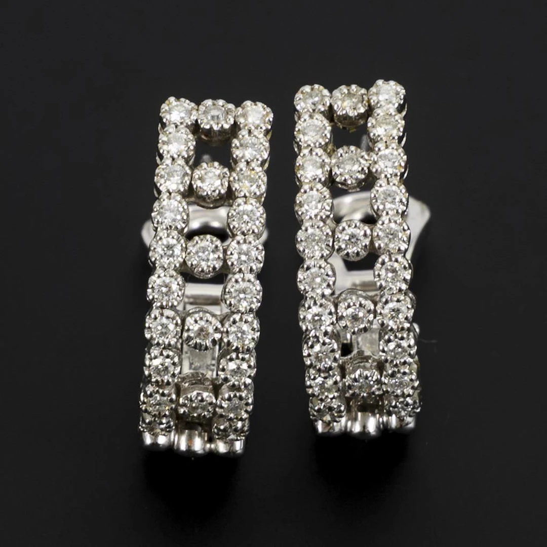 Clip-on earrings in a half-hoop style set with brilliant-cut diamonds.