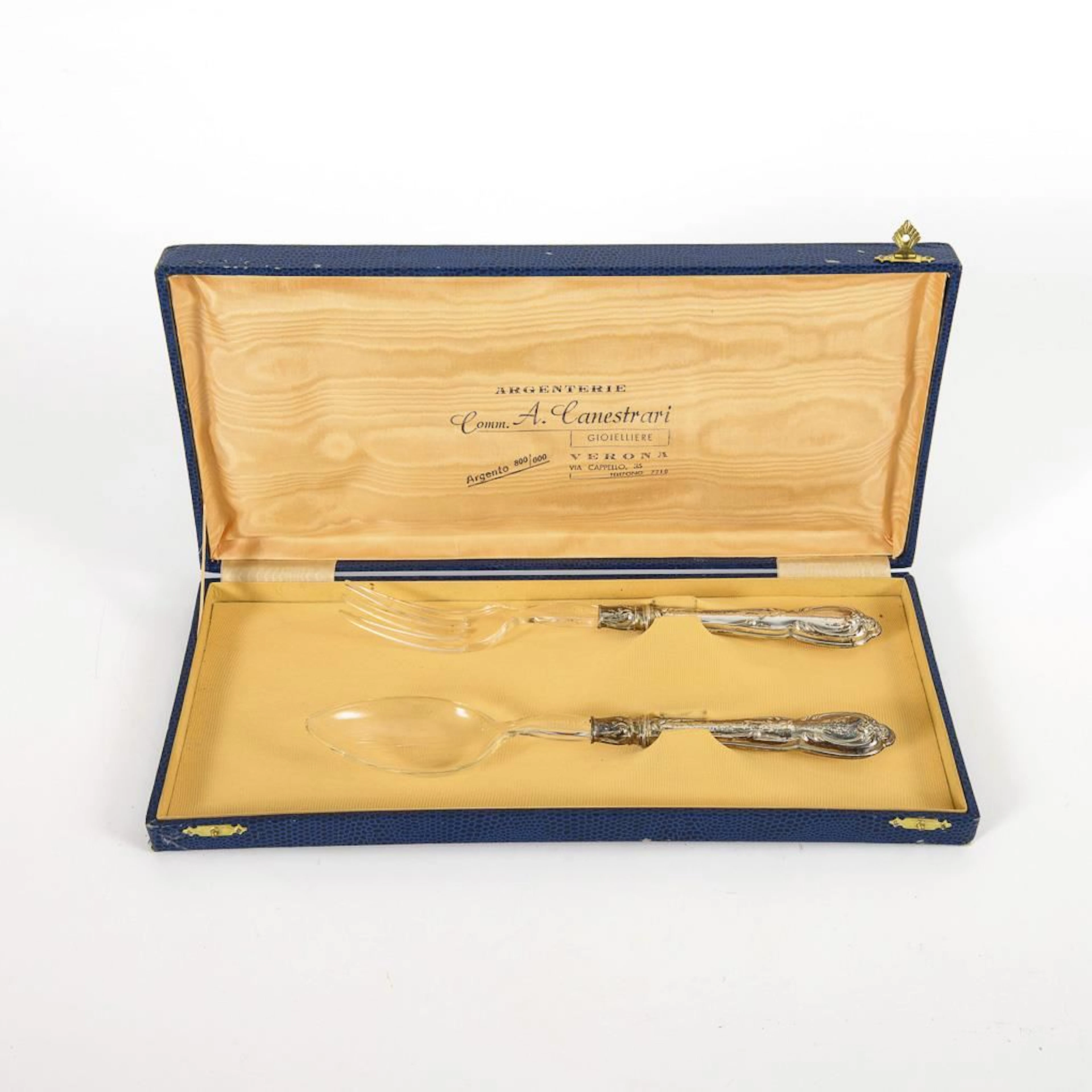 Salad servers with silver handles, in a blue case.