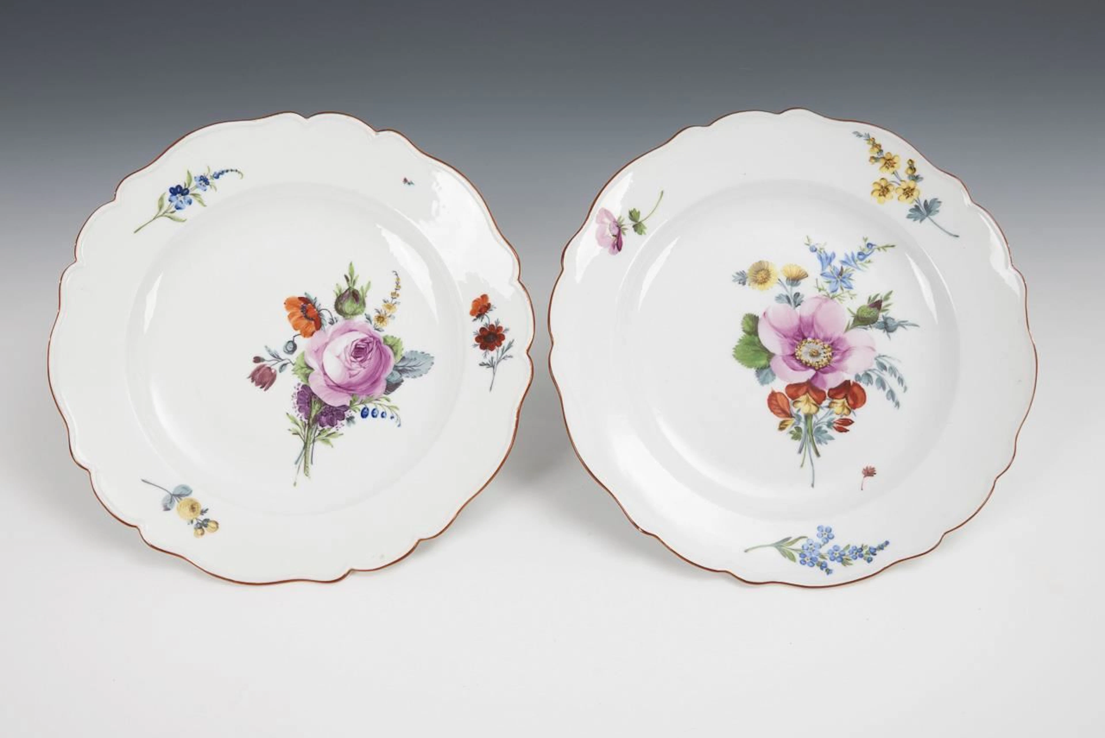 2 dinner plates with floral designs. Meissen.