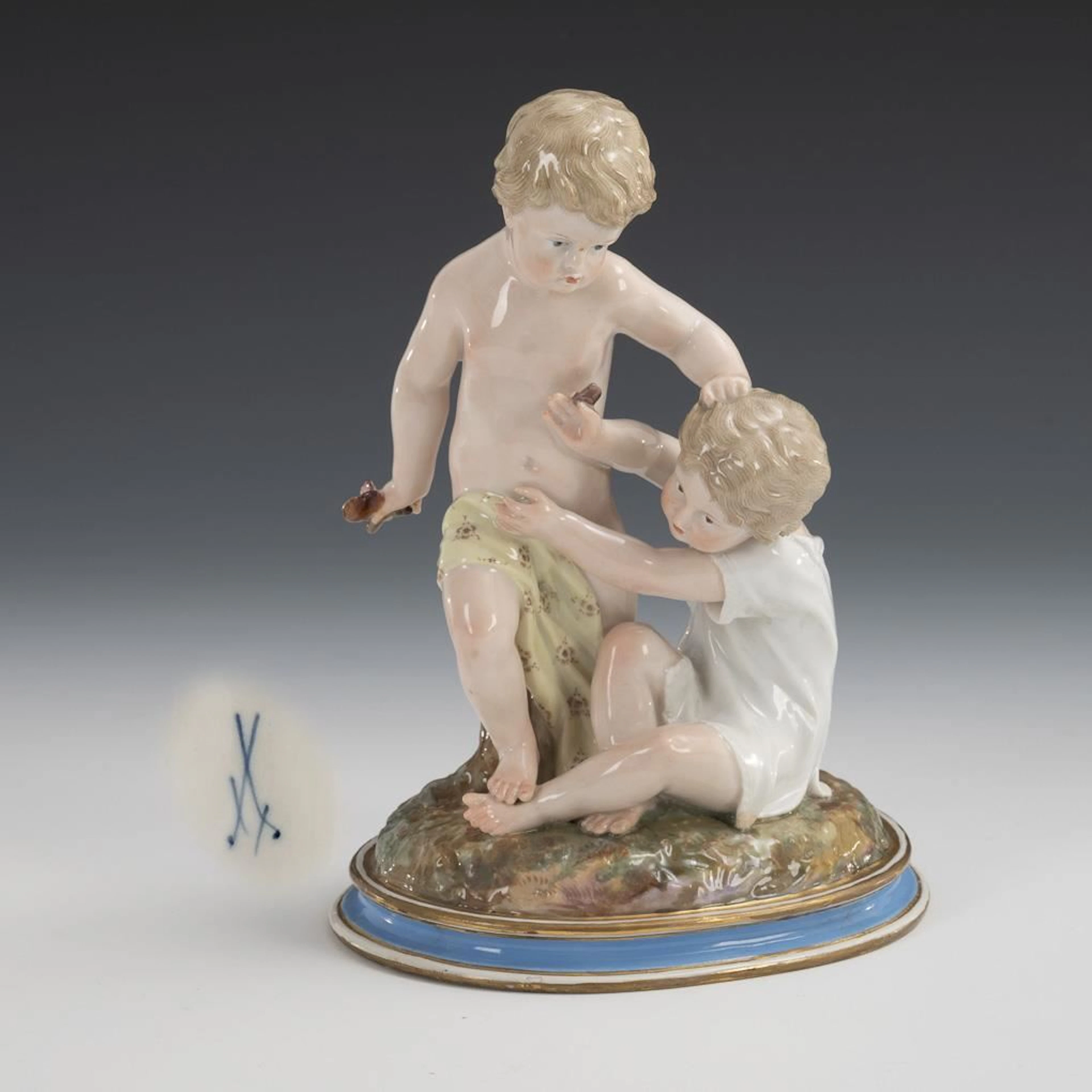Group of cherubs with a butterfly. Meissen.