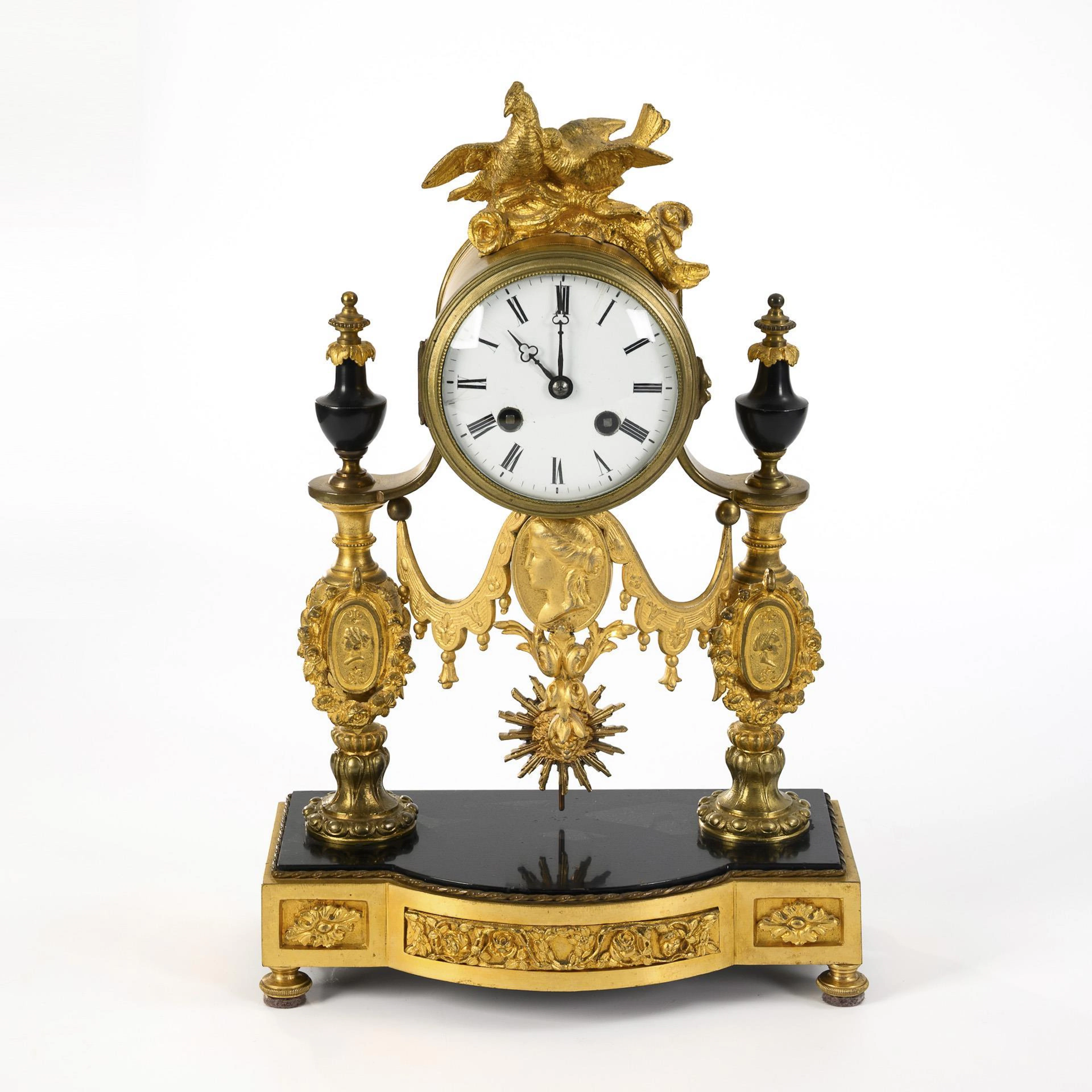 French portal clock with dove finial.