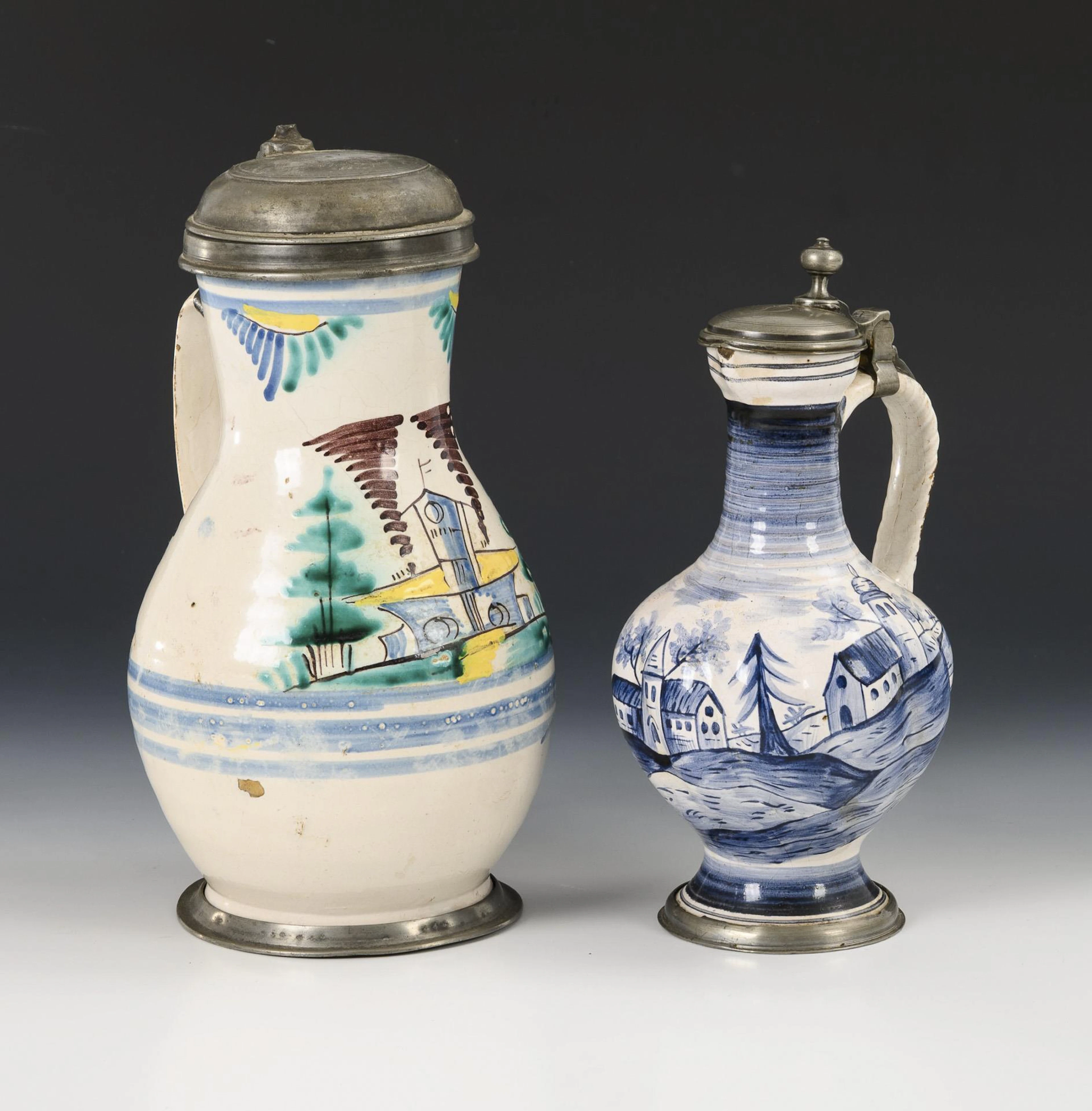 2 faience jugs with architecture. Gmunden and Ansbach.