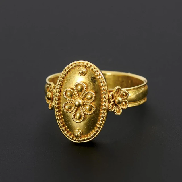 Etruscan Revival-style ring.