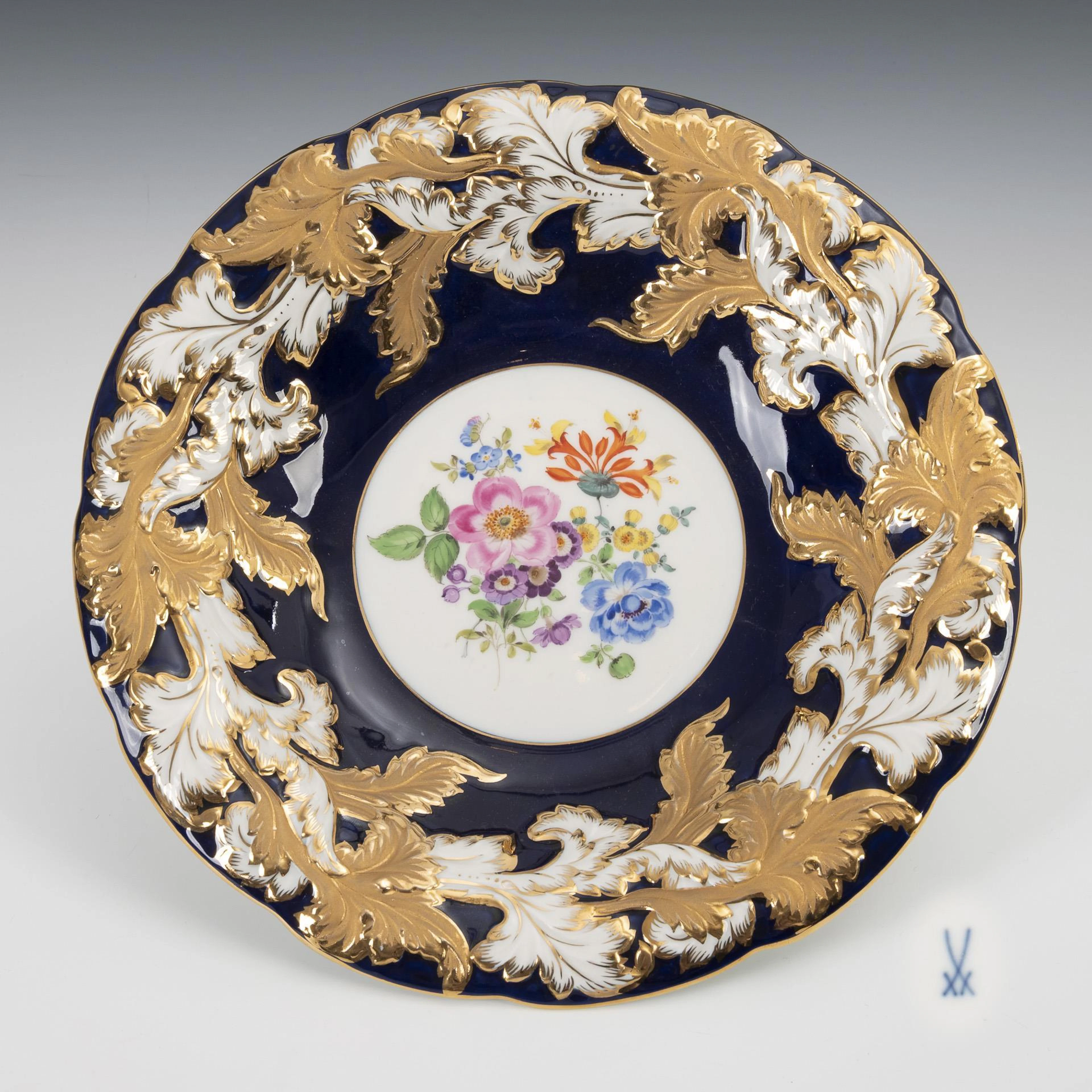 Prunk bowl with cobalt background and flower painting. Meissen.