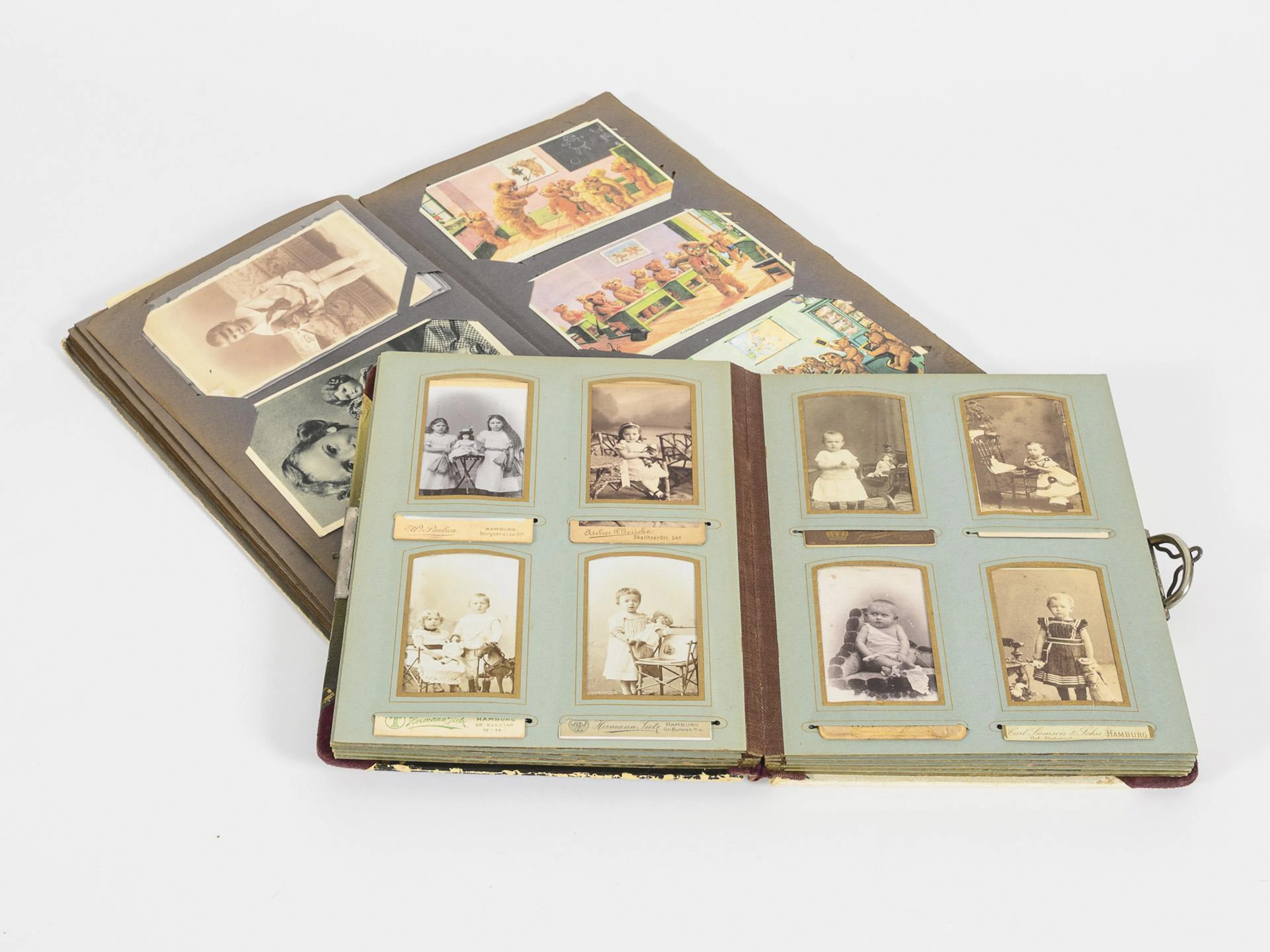 Photo album and postcard album with children and doll motifs
