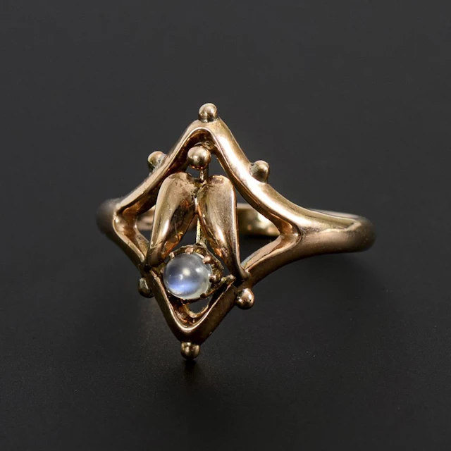 Art Nouveau-style ring with a moonstone cabochon.