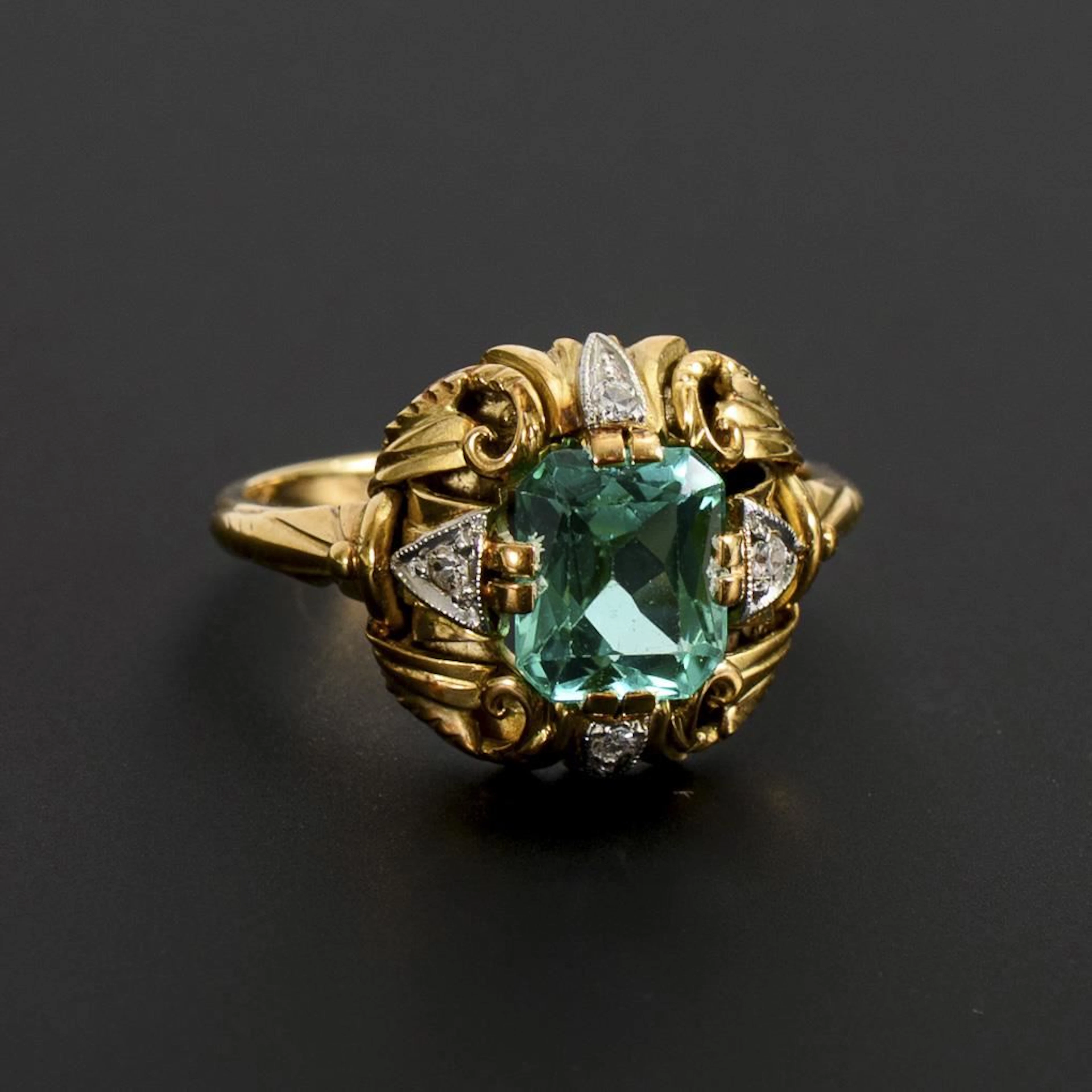 Art Deco ring with a green gemstone.