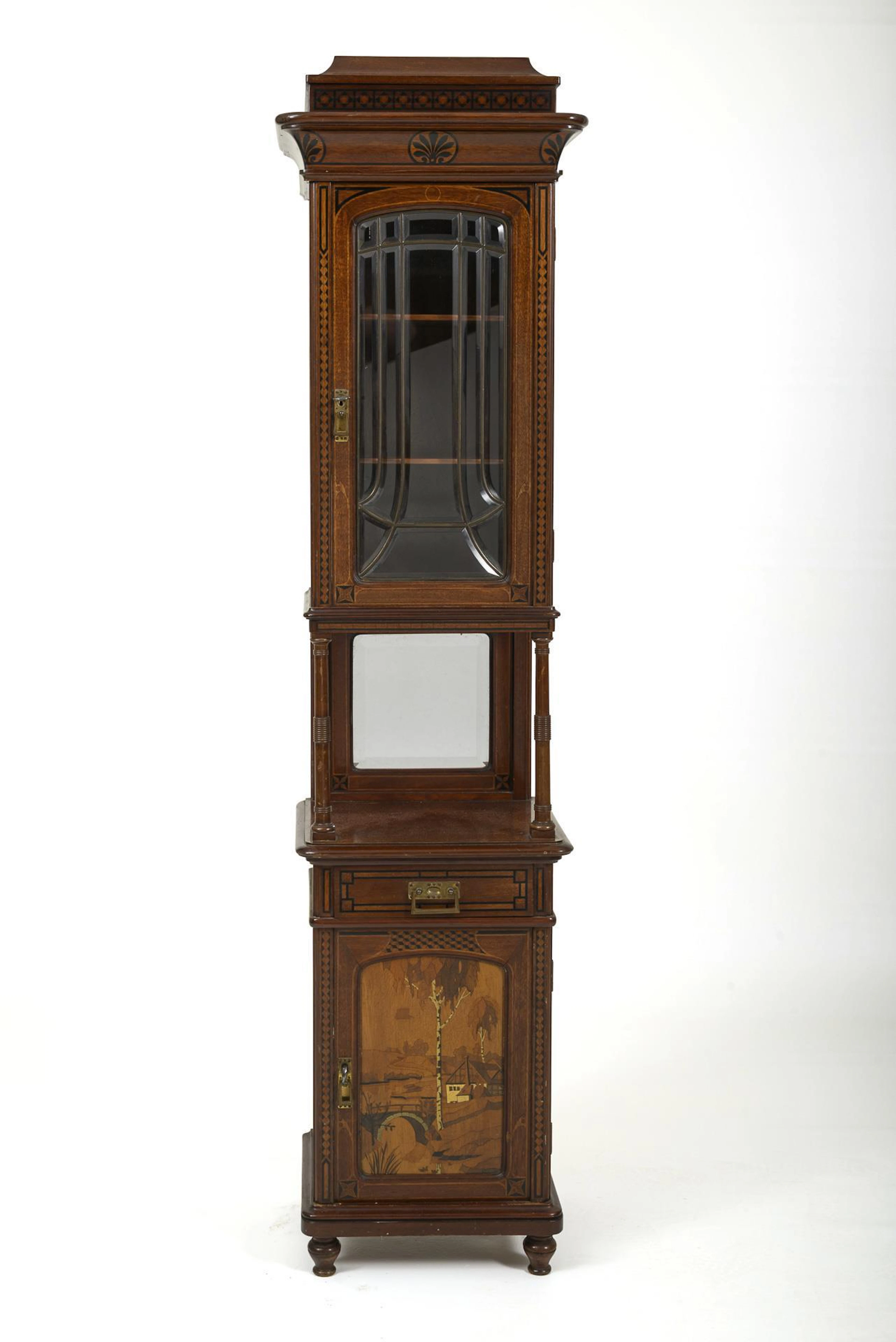 Art Nouveau pillar cabinet with a landscape painting.