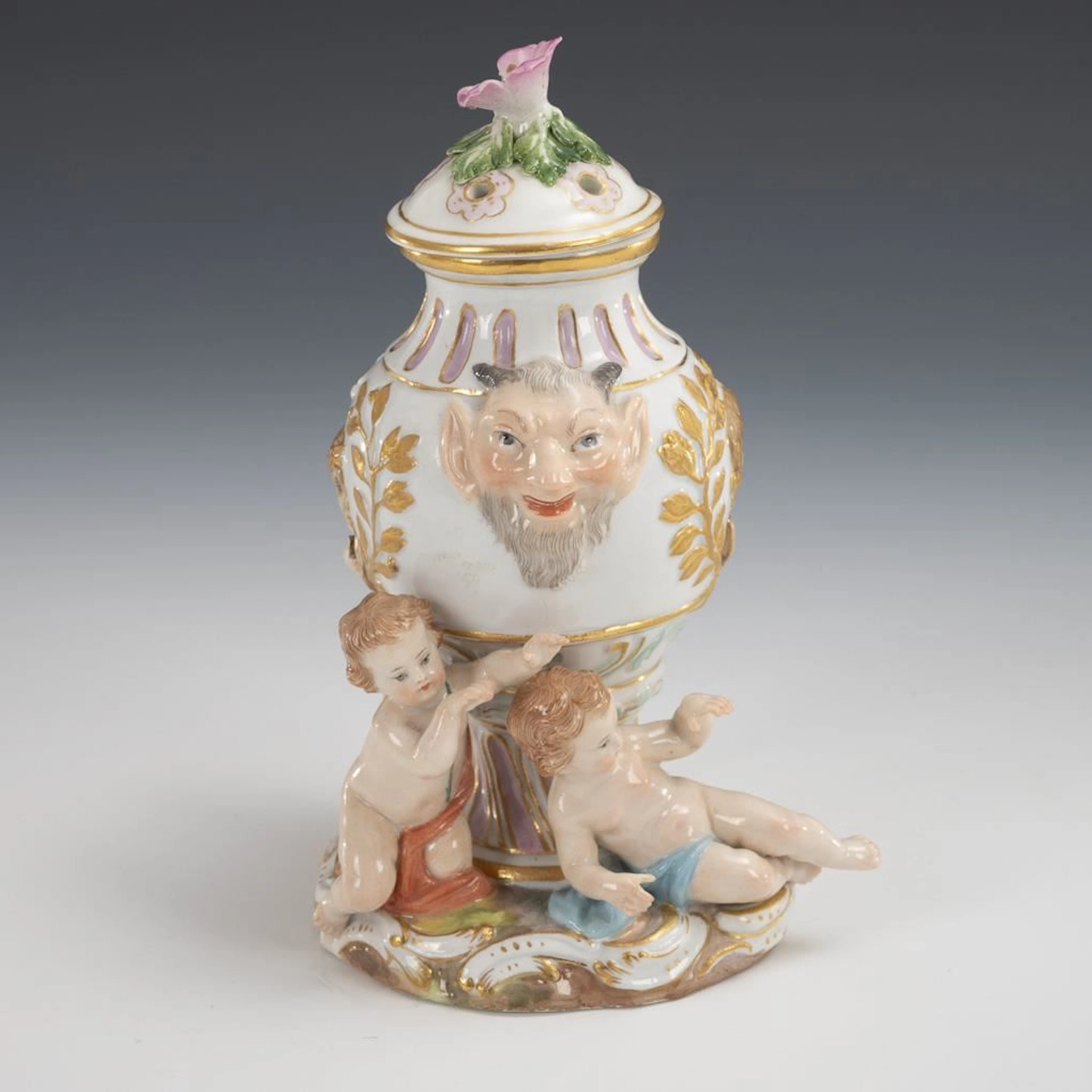 Potpourri vase with cherubs and faun mascarons. Meissen.