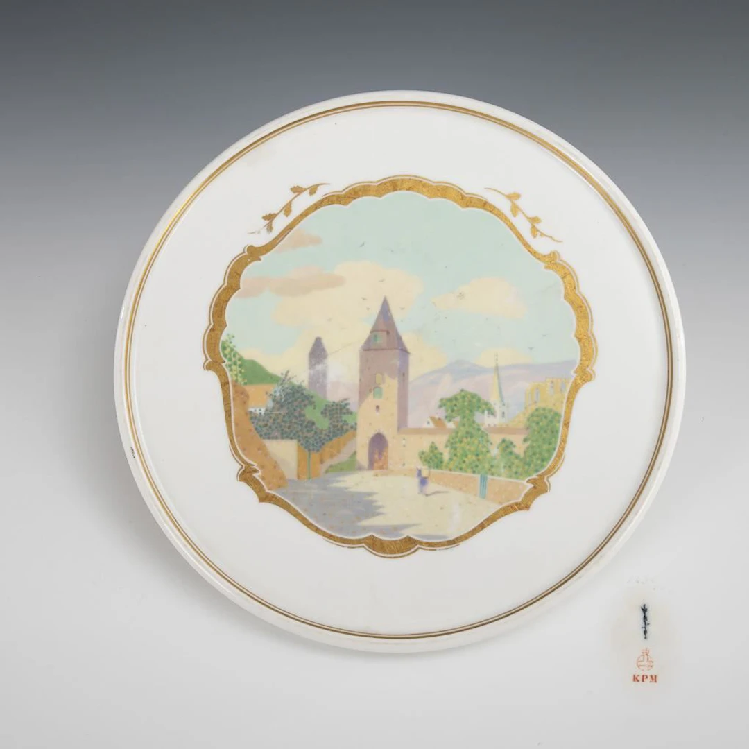 Art Nouveau wall plate depicting a village scene. KPM Berlin.