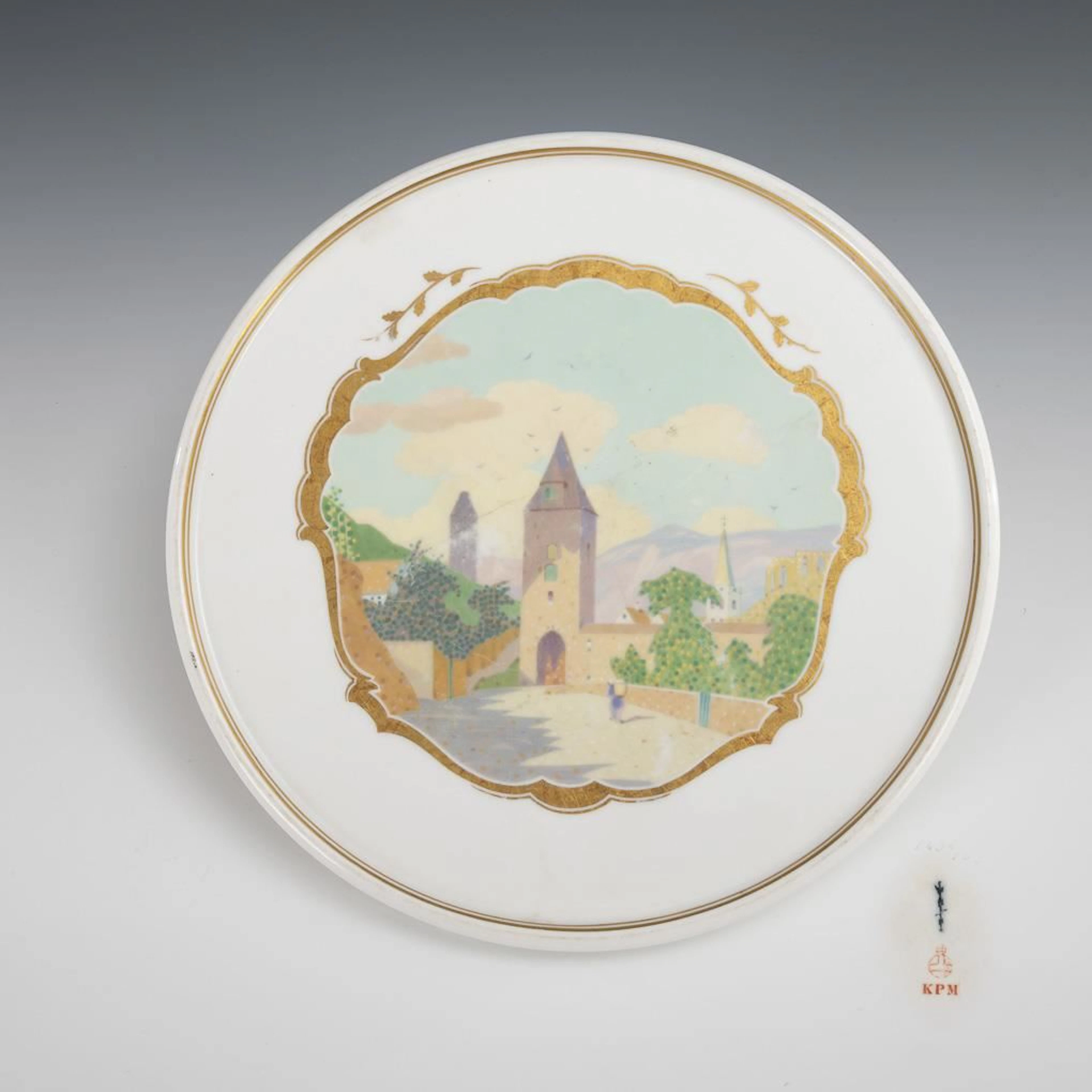 Art Nouveau wall plate depicting a village scene. KPM Berlin.