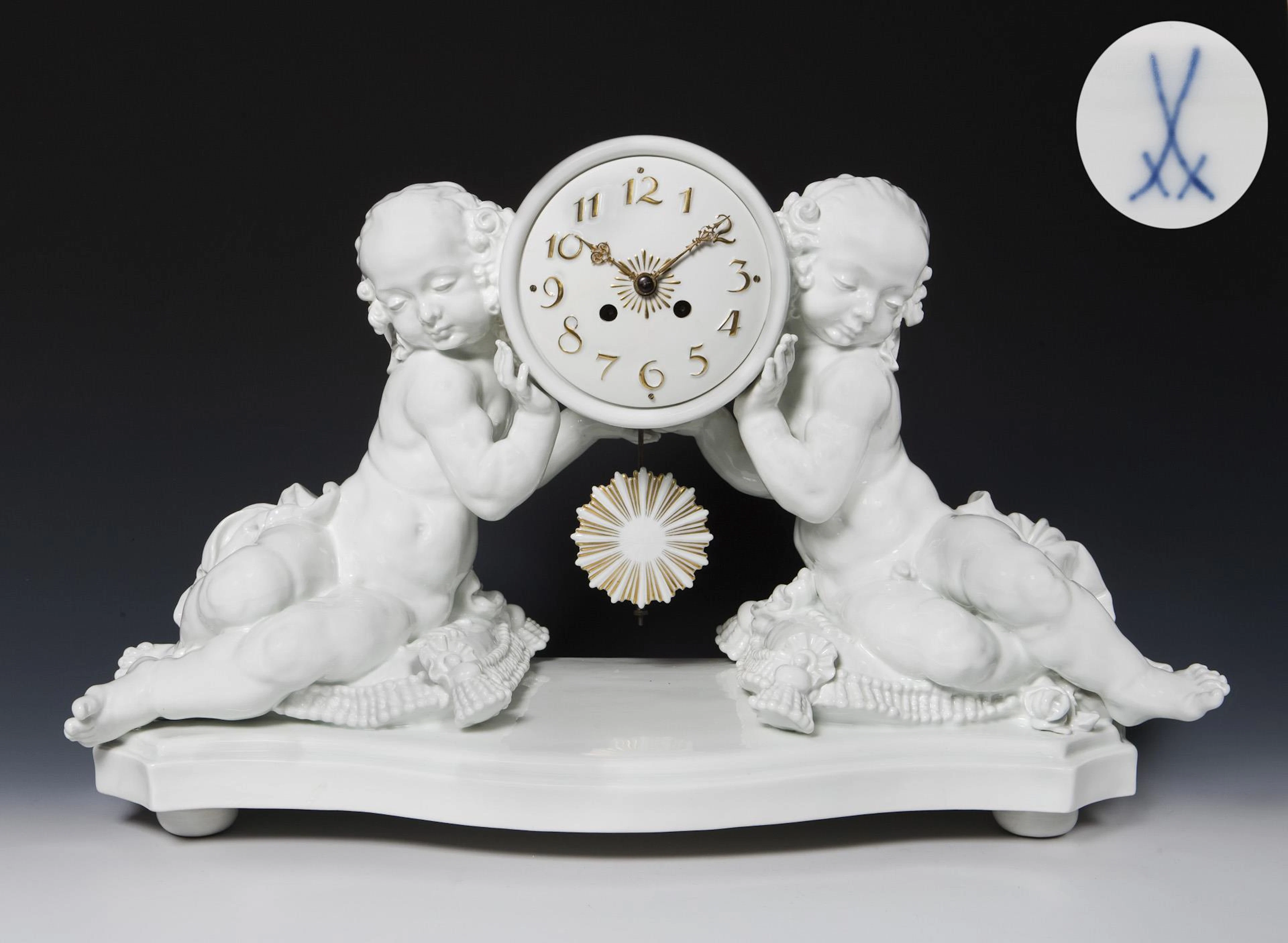 Amorettes with clock case. Meissen.