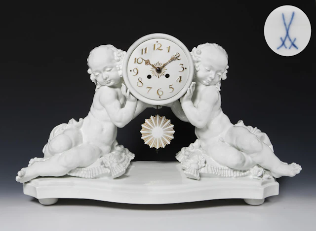 Amorettes with clock case. Meissen.