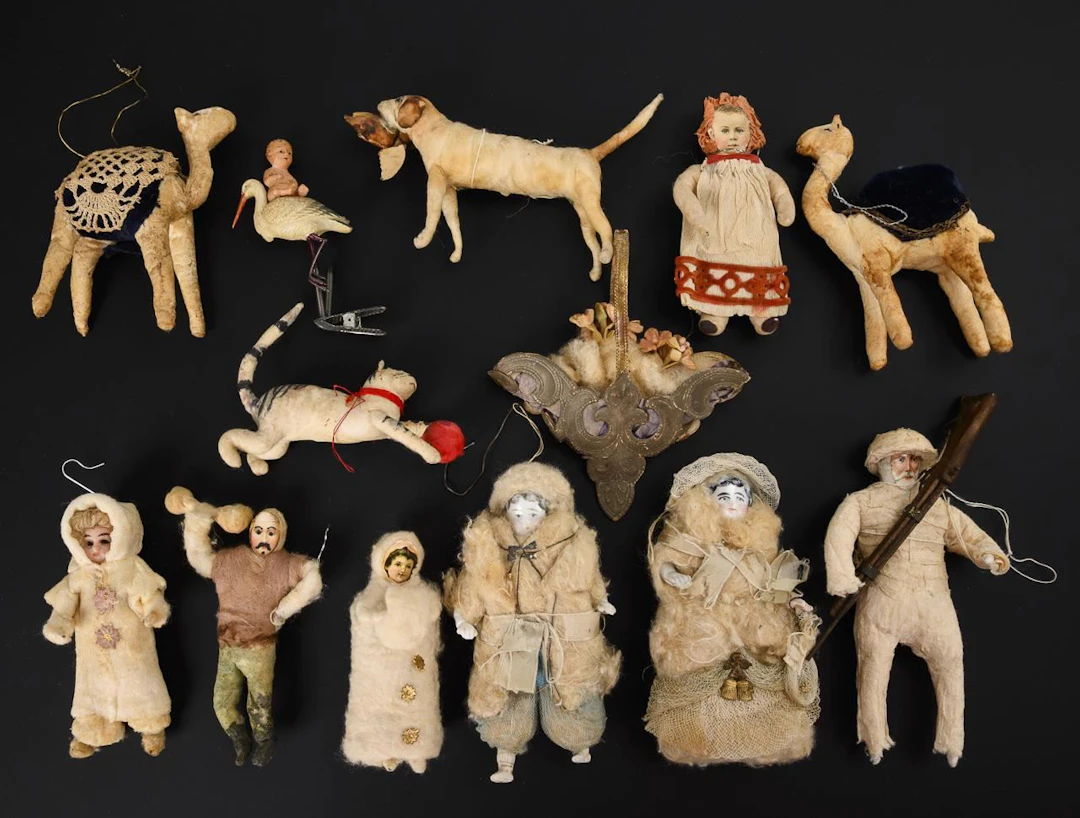 Set of 12 cotton figures and 1 celluloid stork.
