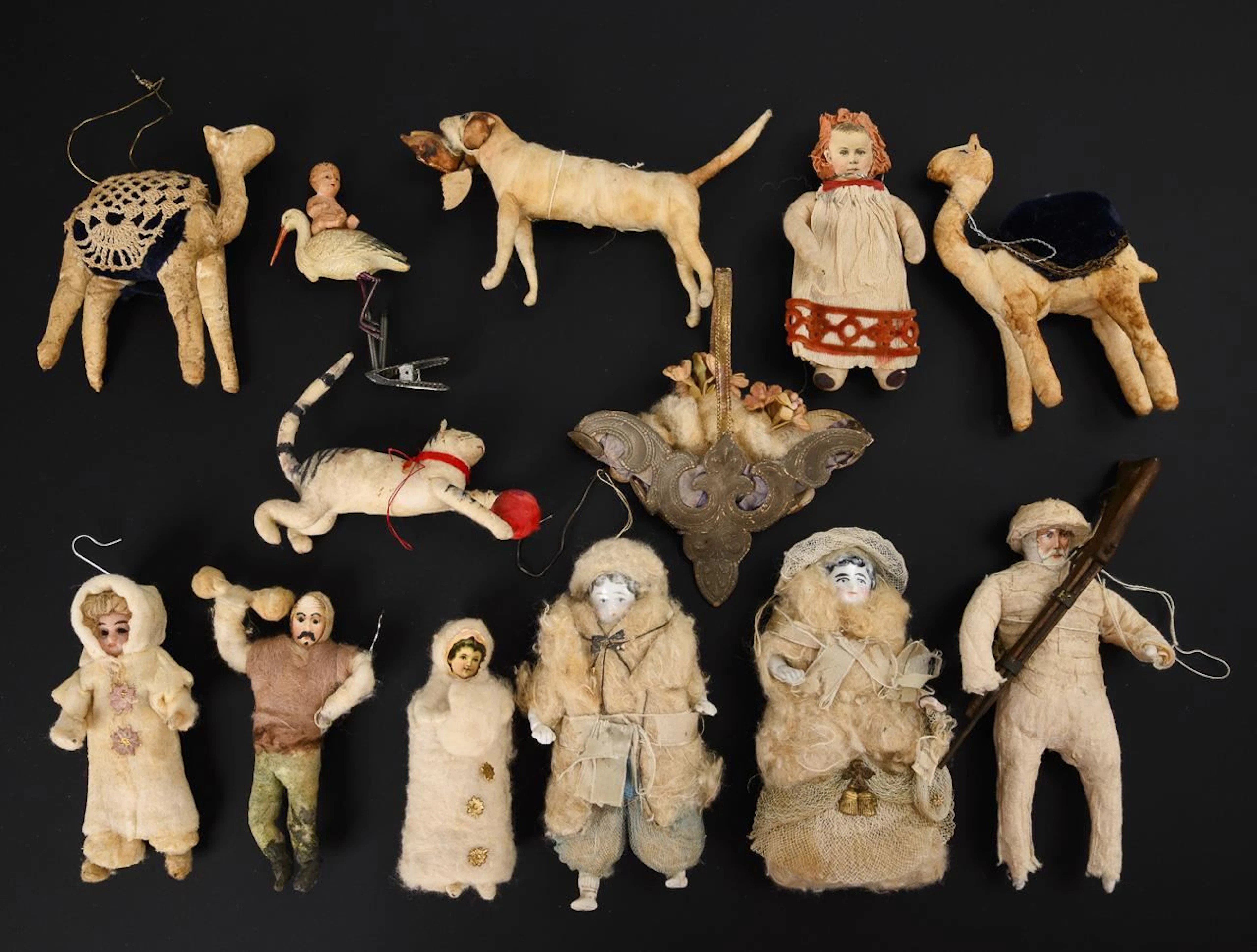 Set of 12 cotton figures and 1 celluloid stork.