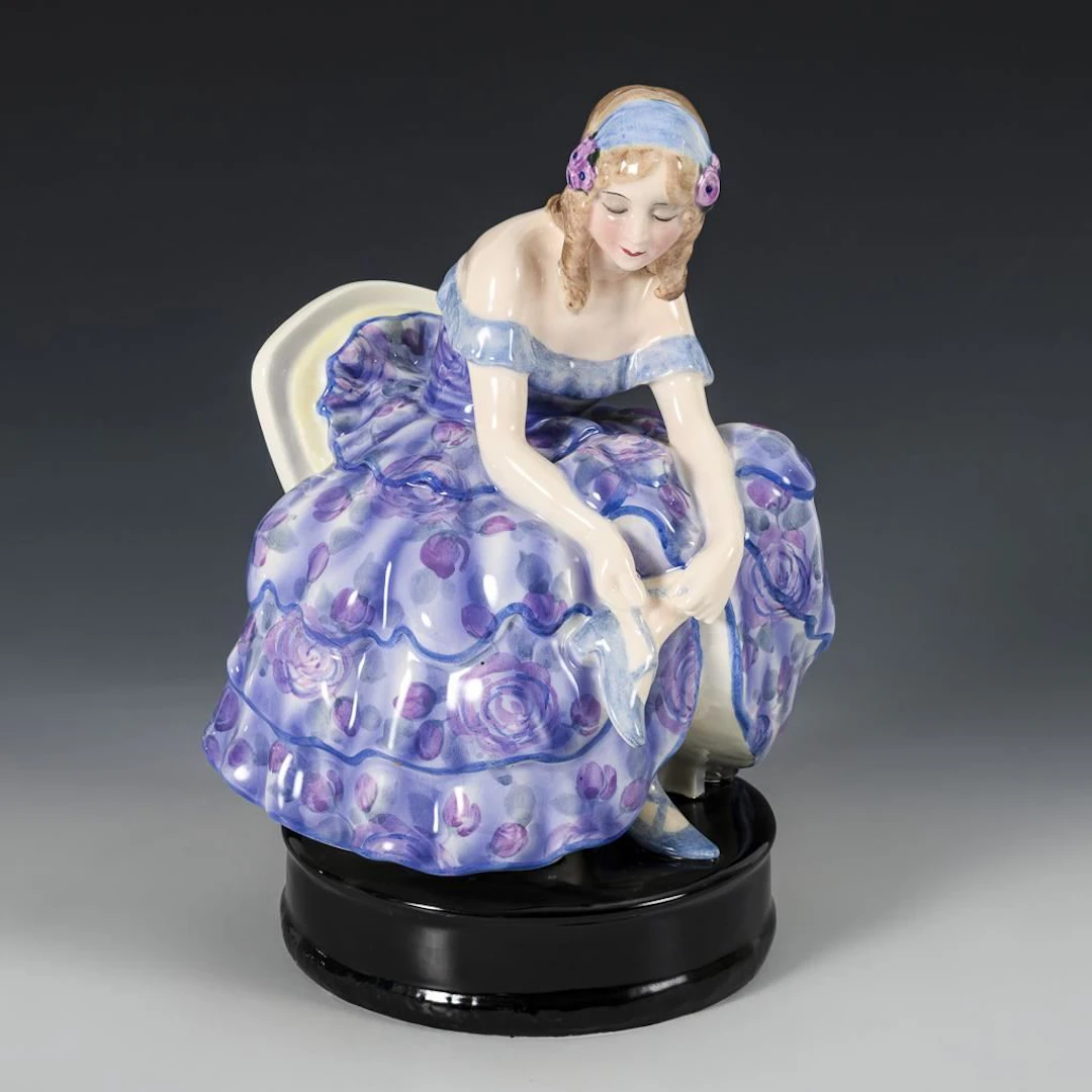 Figurine "Seated Dancer Tying Her Shoes". Vienna-based manufacturer