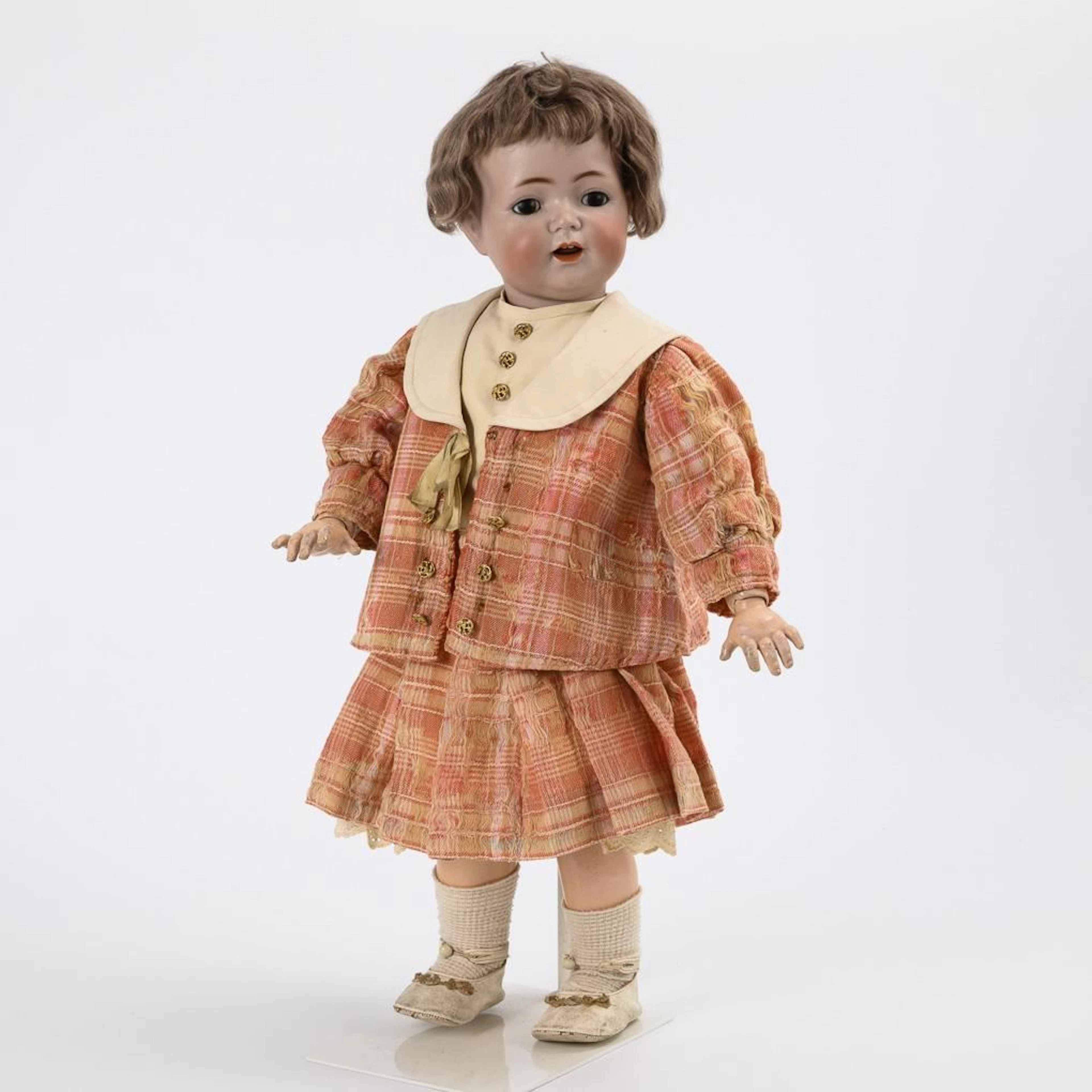 Character doll in a pink plaid costume. Kämmer & Reinhardt. Head mark: