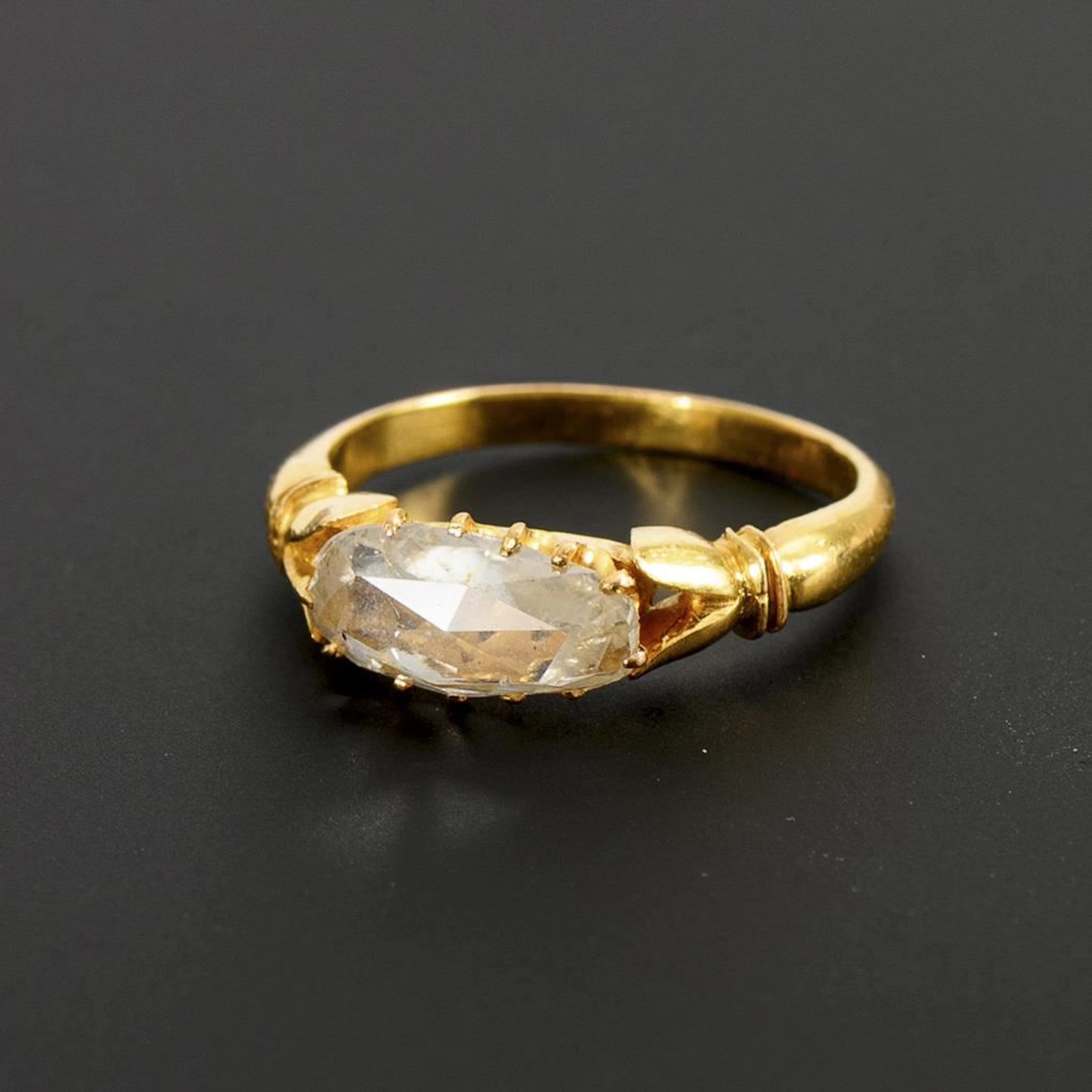 Unusual ring with a slightly teardrop-shaped diamond.