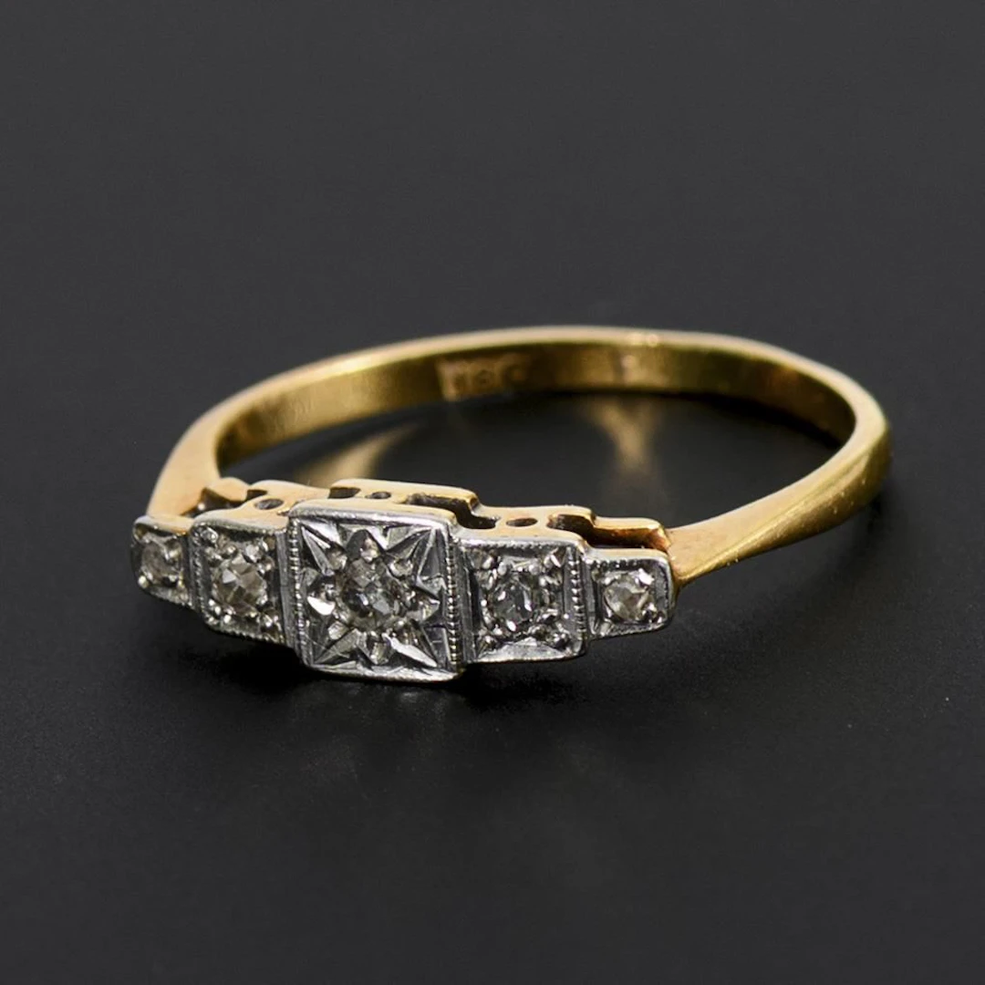 Delicate Art Deco ring with small diamonds.