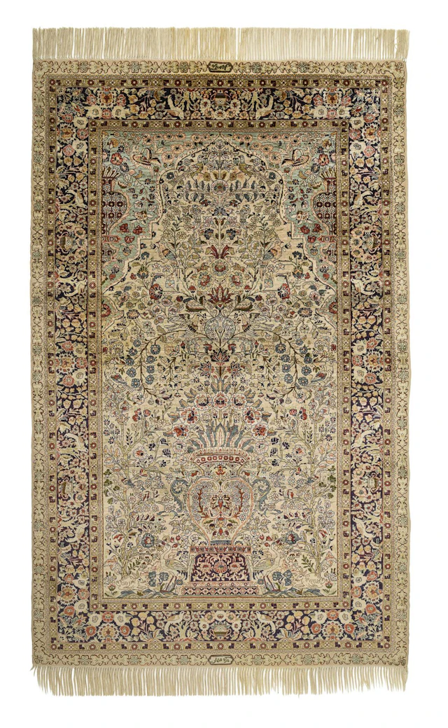 Signed silk prayer rug with vases and animals.