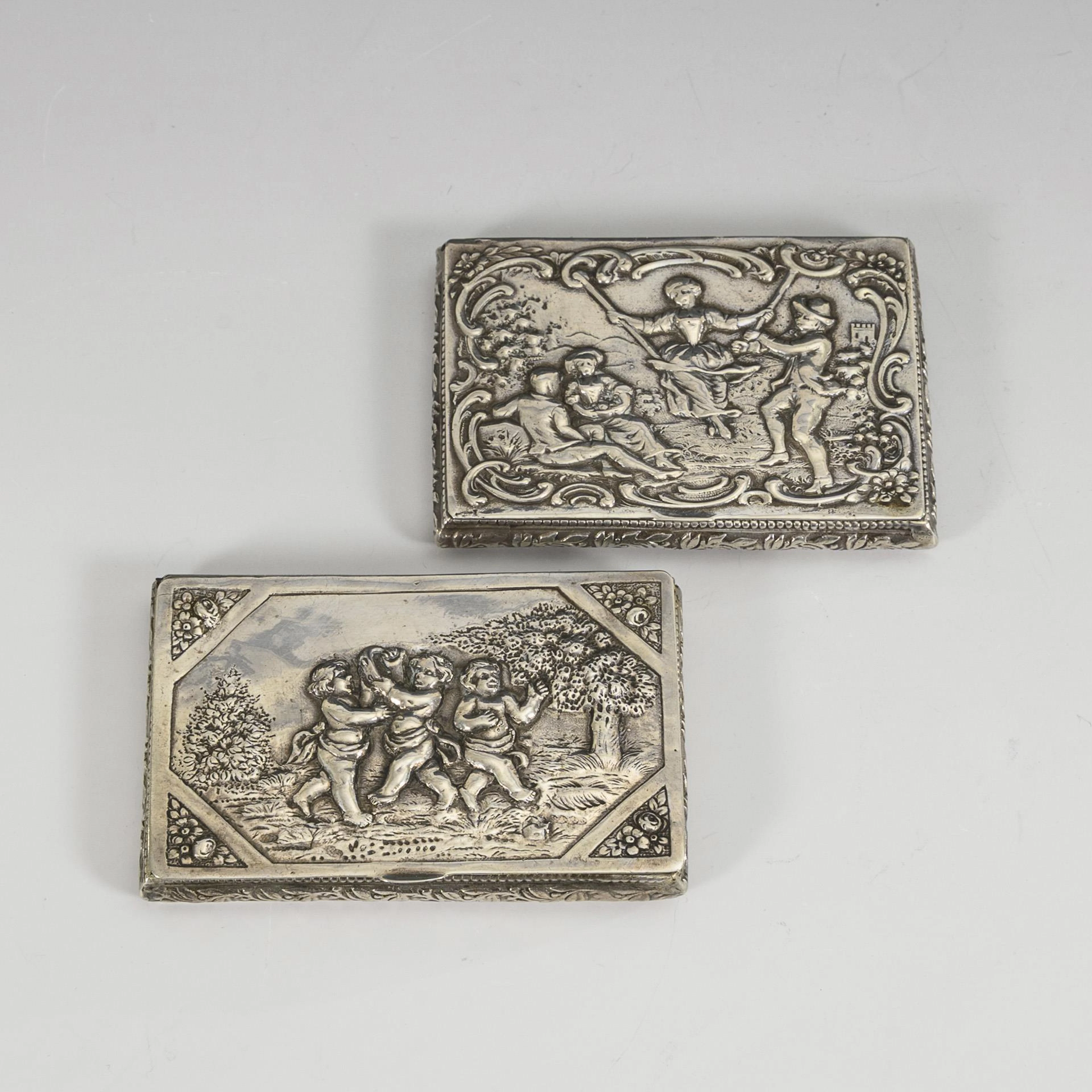 2 small silver cases.