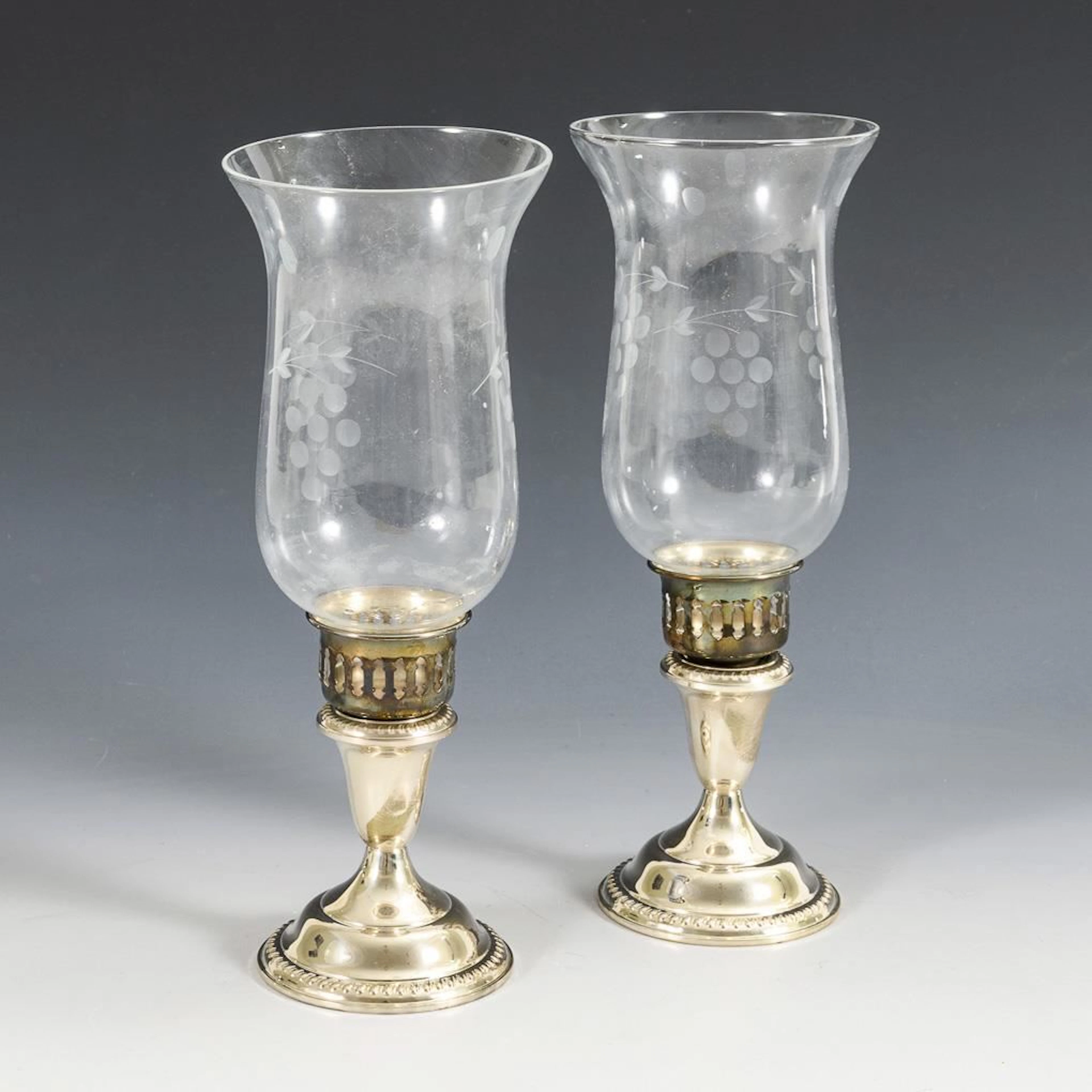 Pair of lanterns with silver bases.