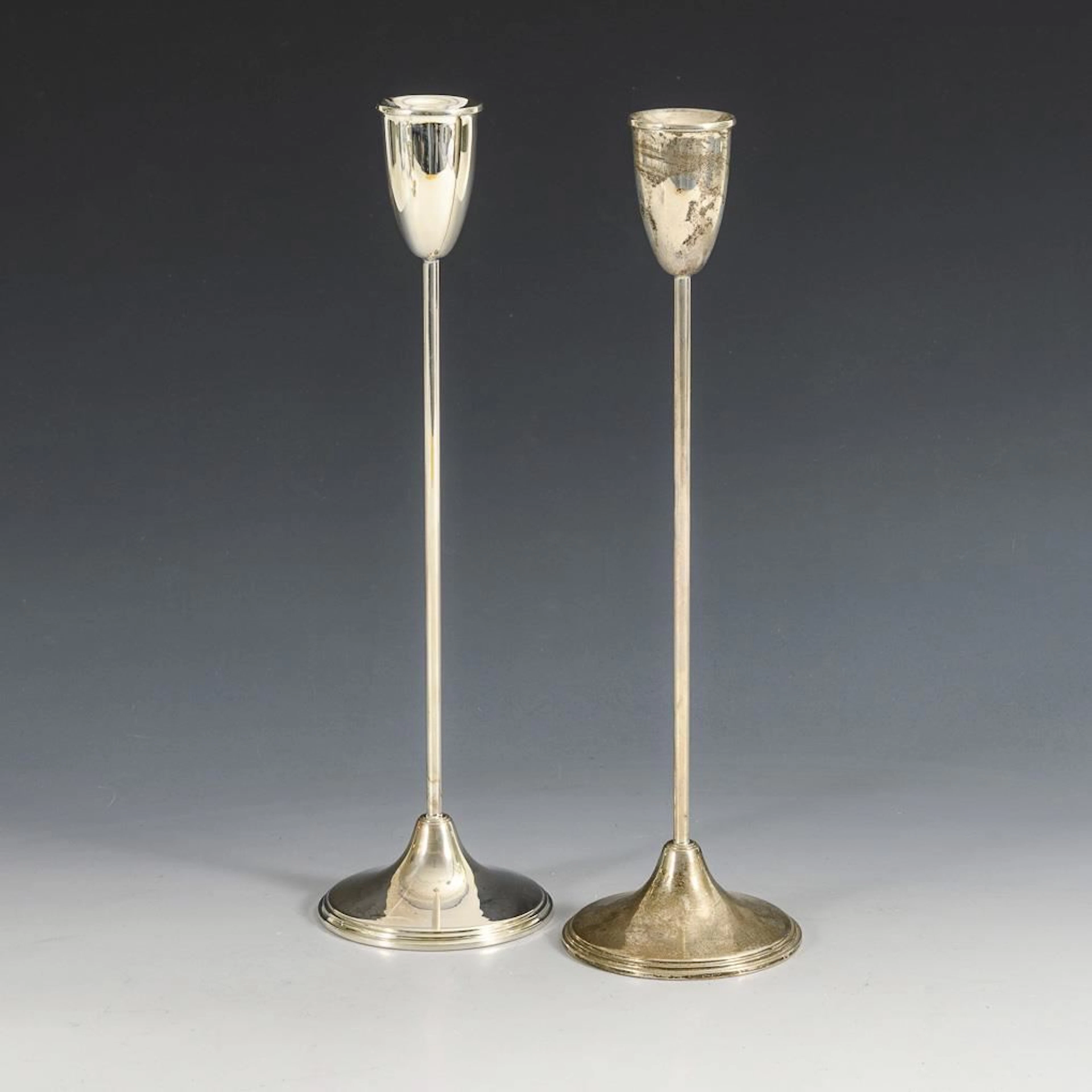Pair of silver tulip candlesticks.