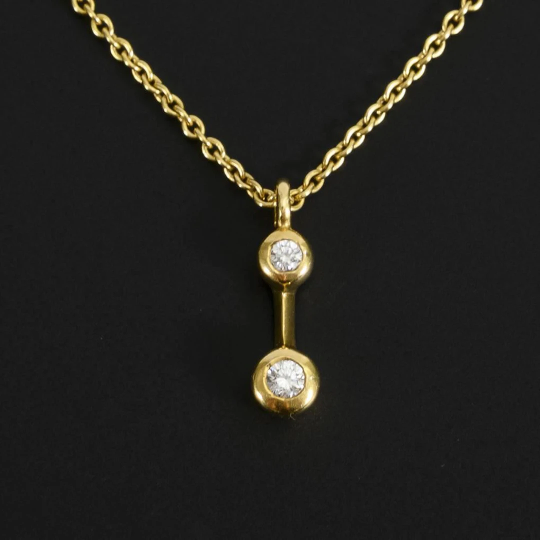Necklace with diamond pendant.
