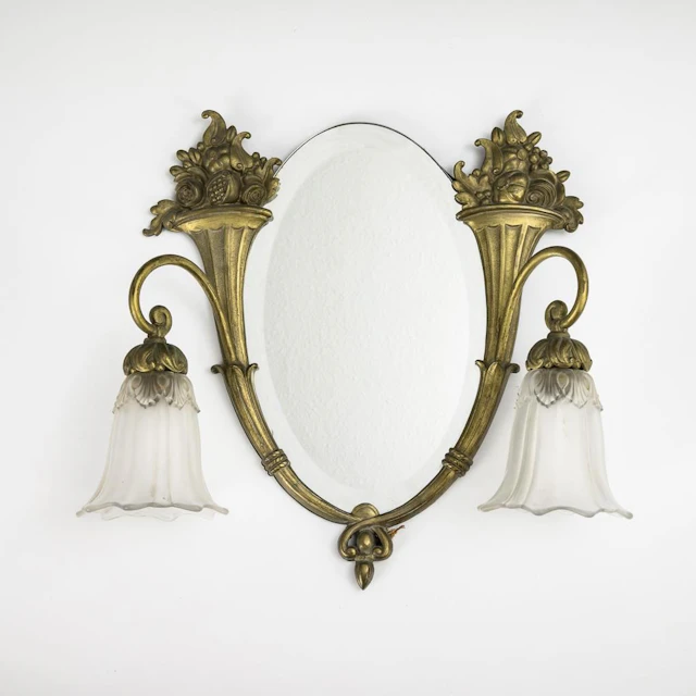 Art Deco mirror with two lamps.