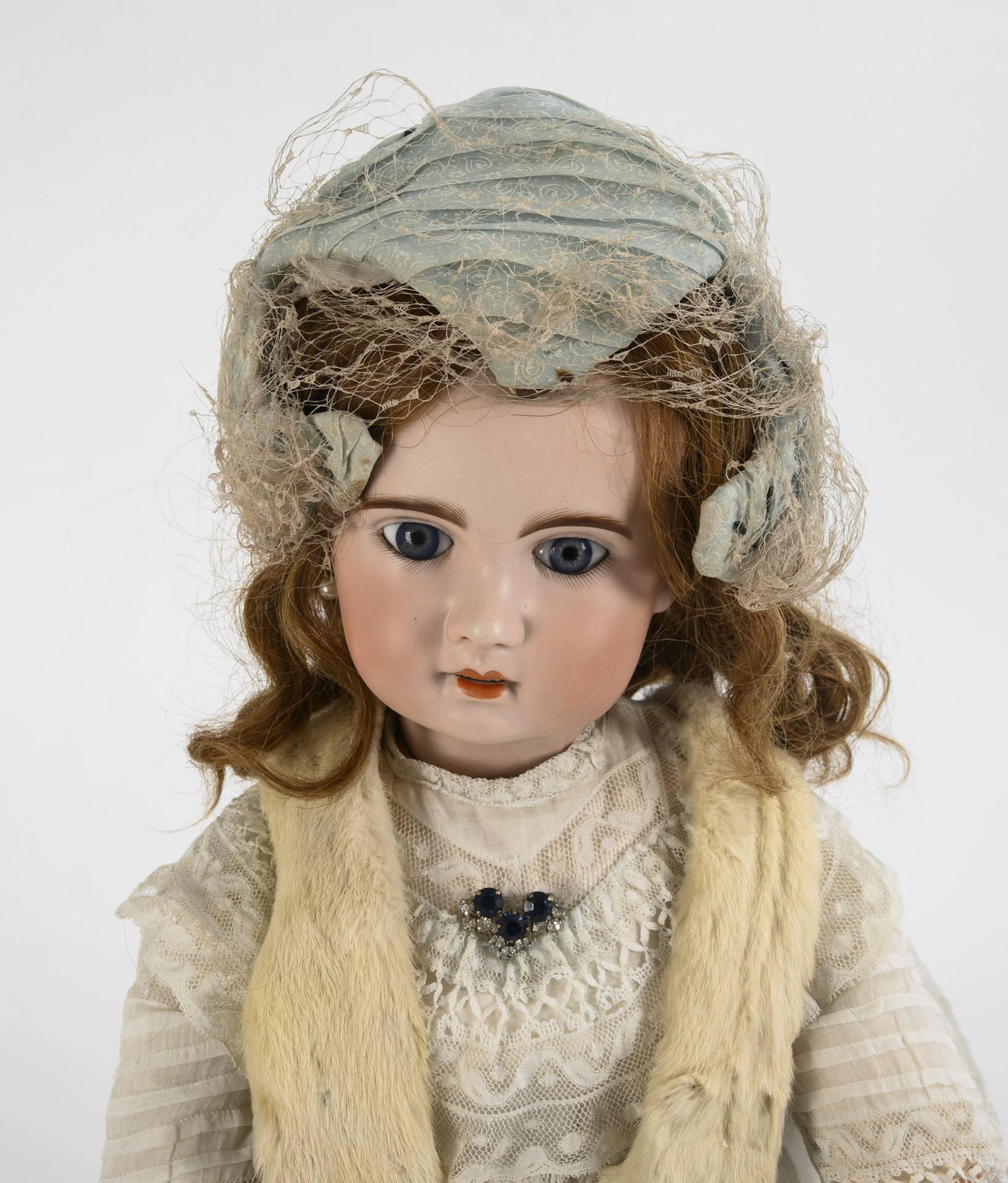 French woman with fur necklace. Well Jumeau.