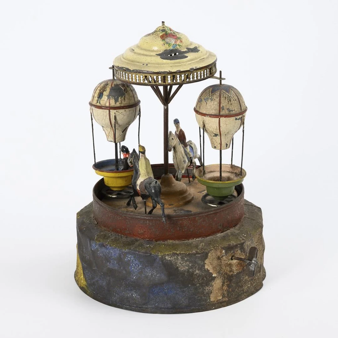 Rare, early tin carousel with music.