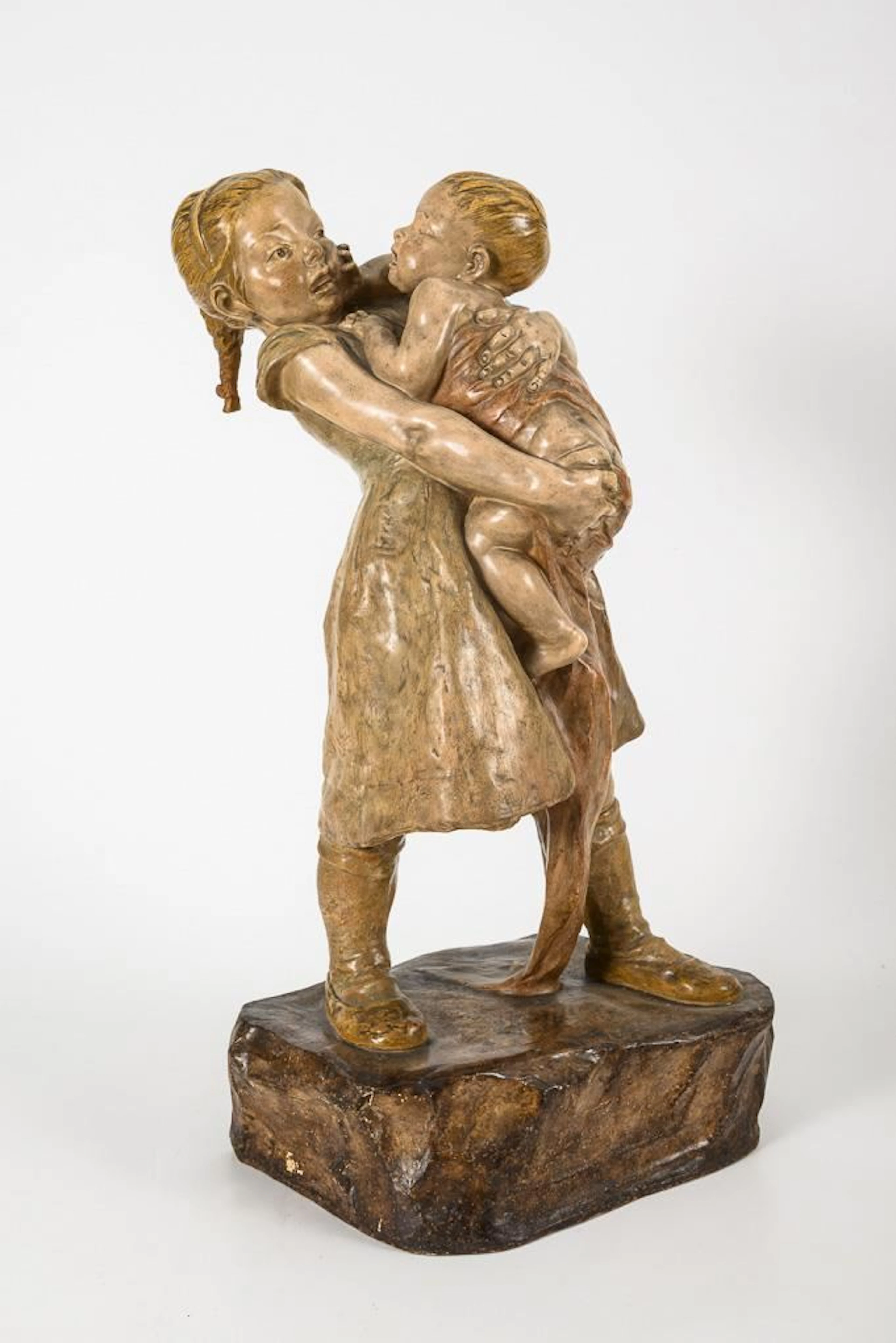 Group of children: Girl with an infant.