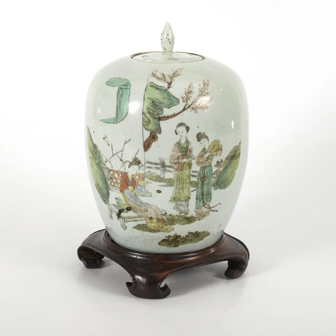 Lidded vase with base.