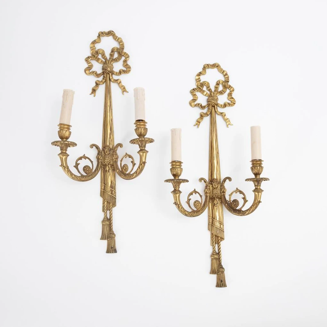Pair of 2-flame wall sconces in the Louis XVI style.
