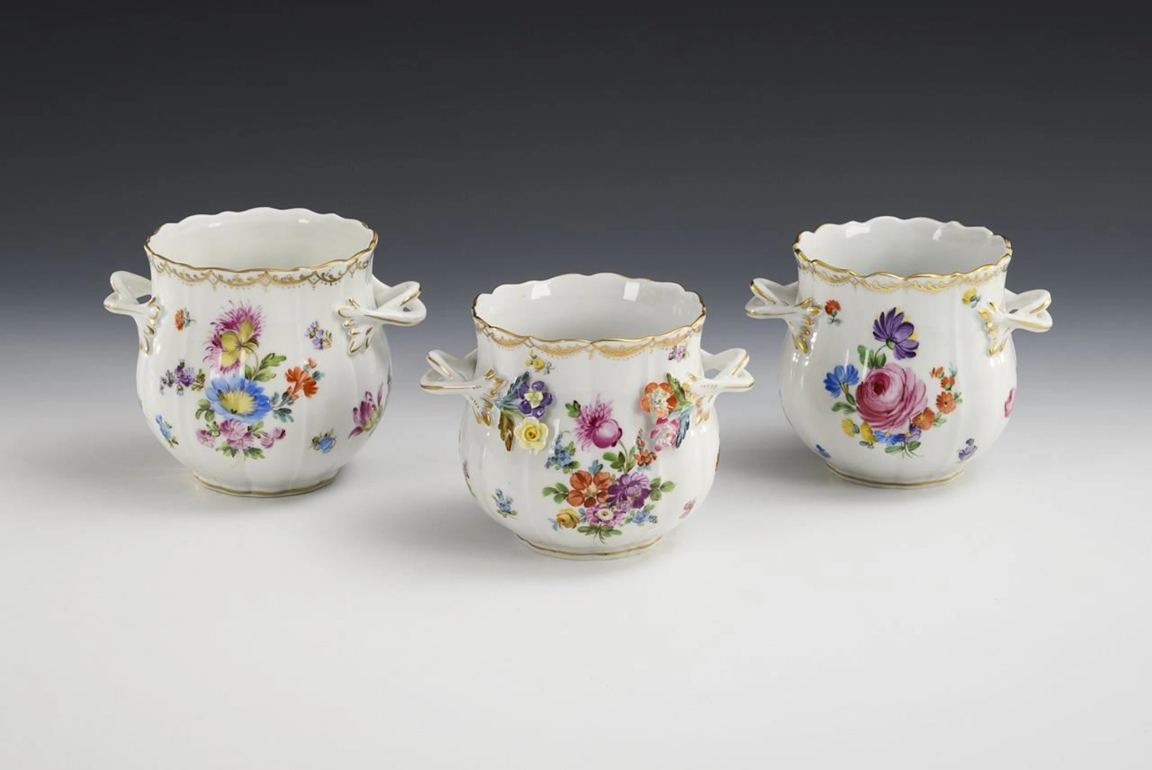 3 cachepots with floral designs. Potschappel.