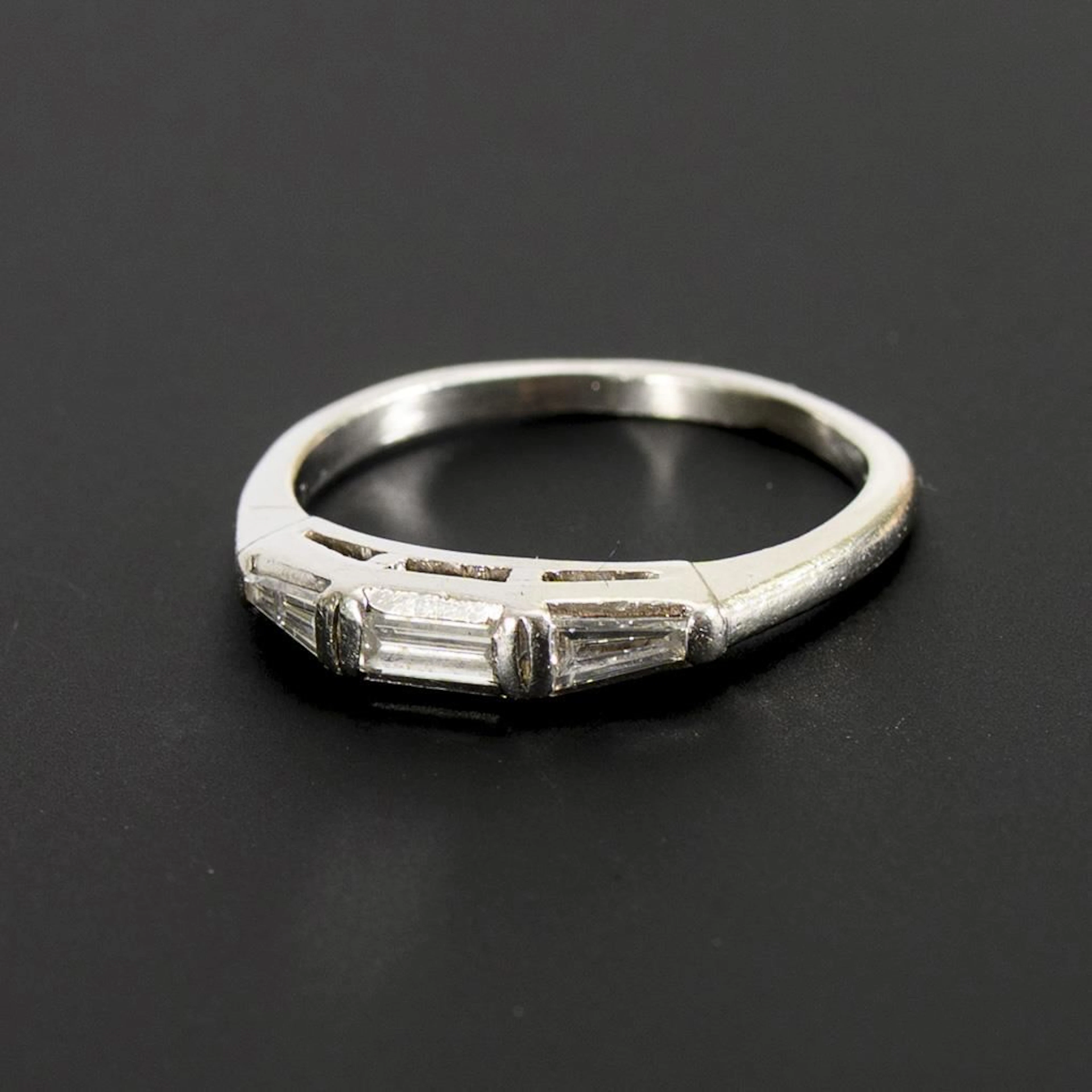 Platinum ring with 3 diamonds.