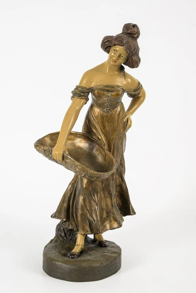 Art Nouveau figurine: Woman with a basket.