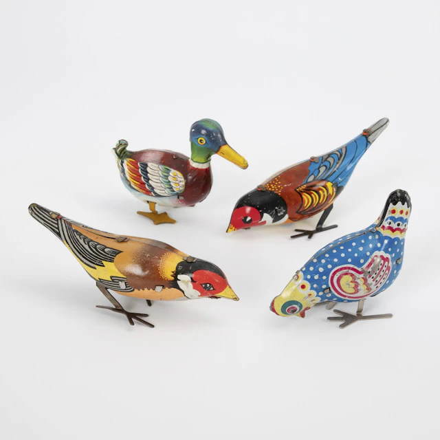 4 mechanical tin birds.