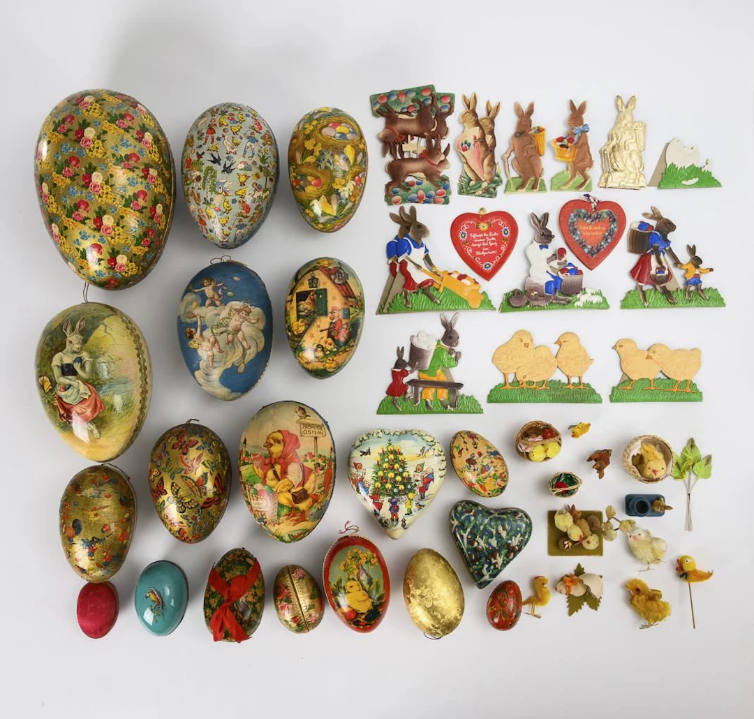 Collection of 17 cardboard Easter eggs and standing figures made of
