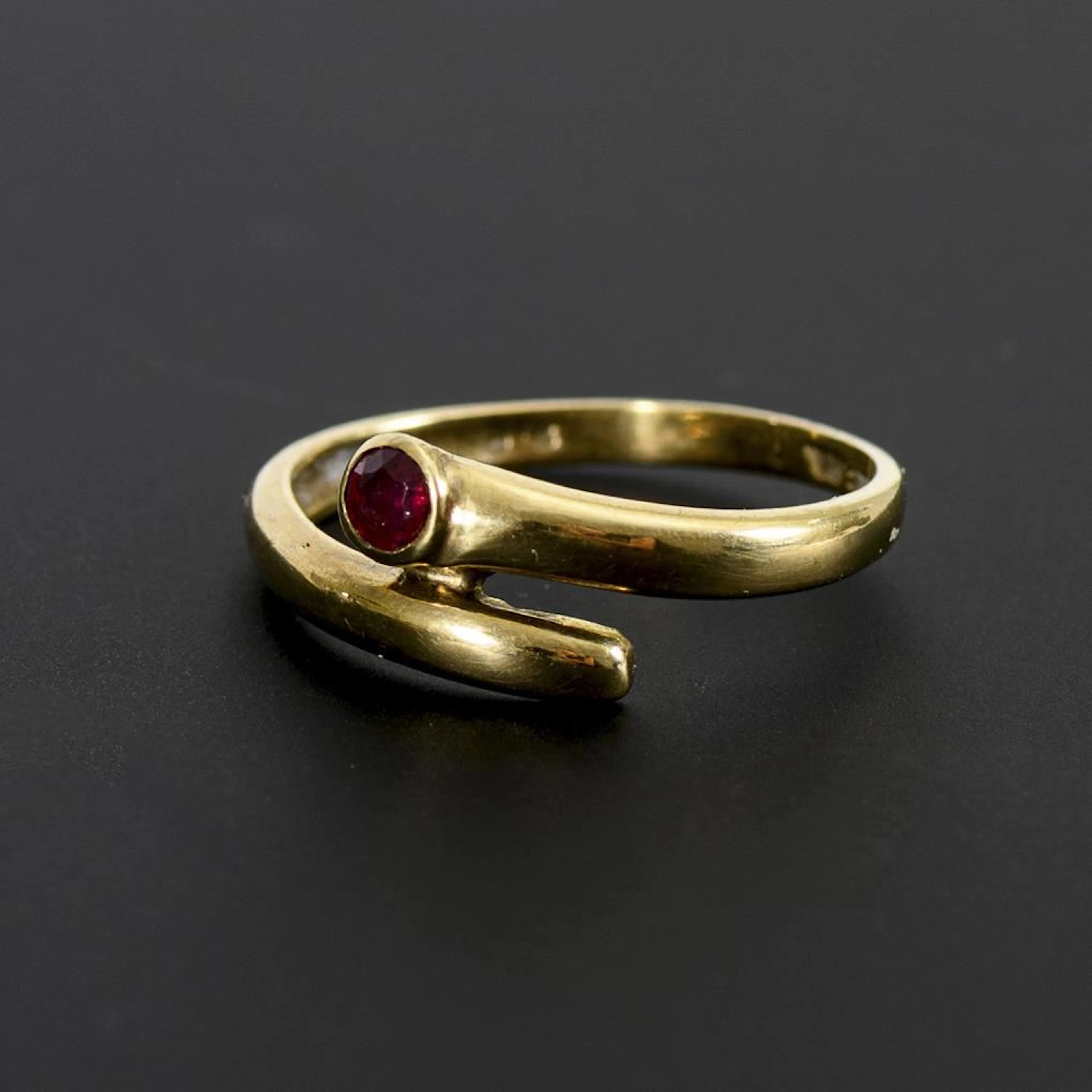 Ring with a red gemstone, likely a ruby.