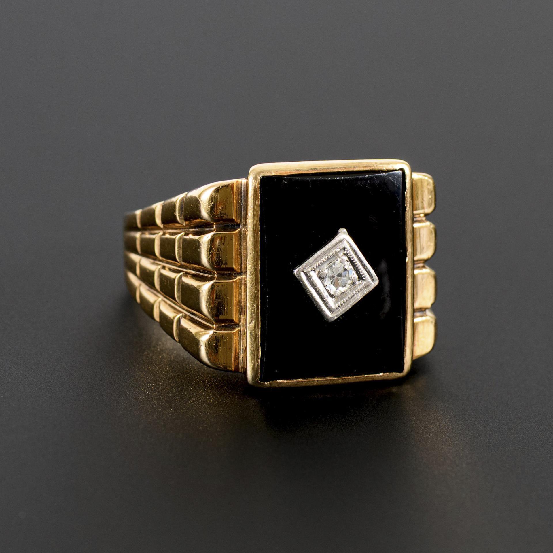Large ring with onyx and diamond.