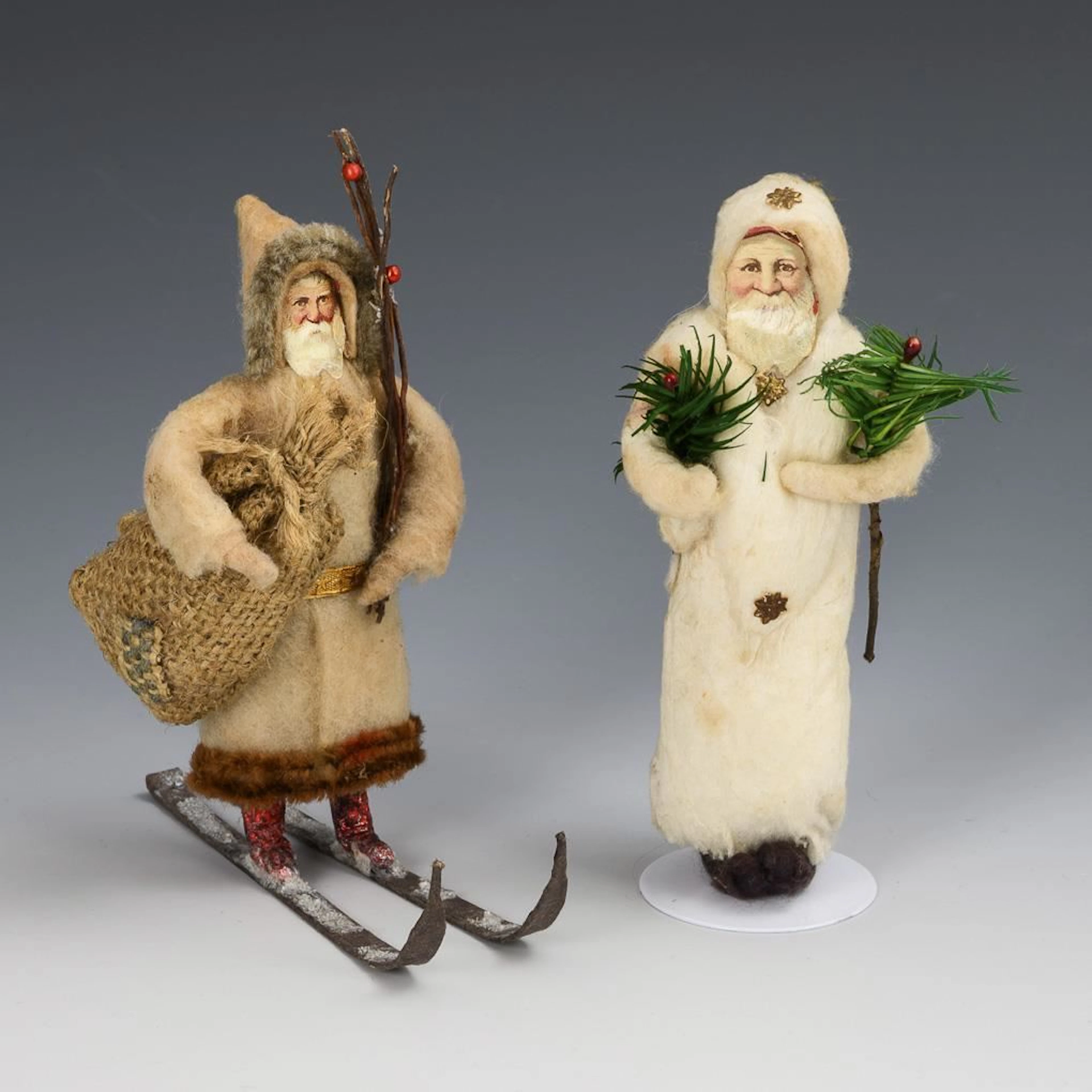 2 old cotton figures.