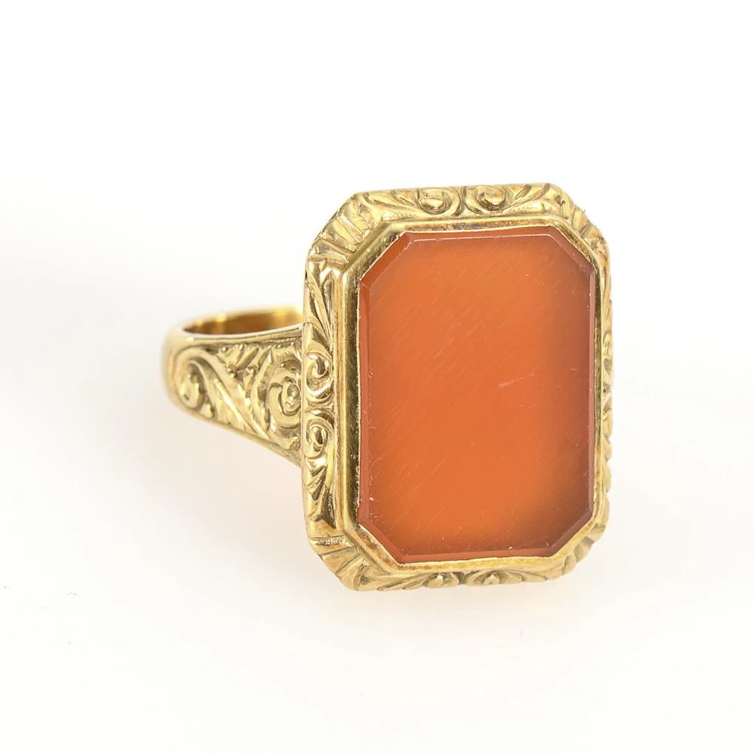 Ring with a carnelian panel.