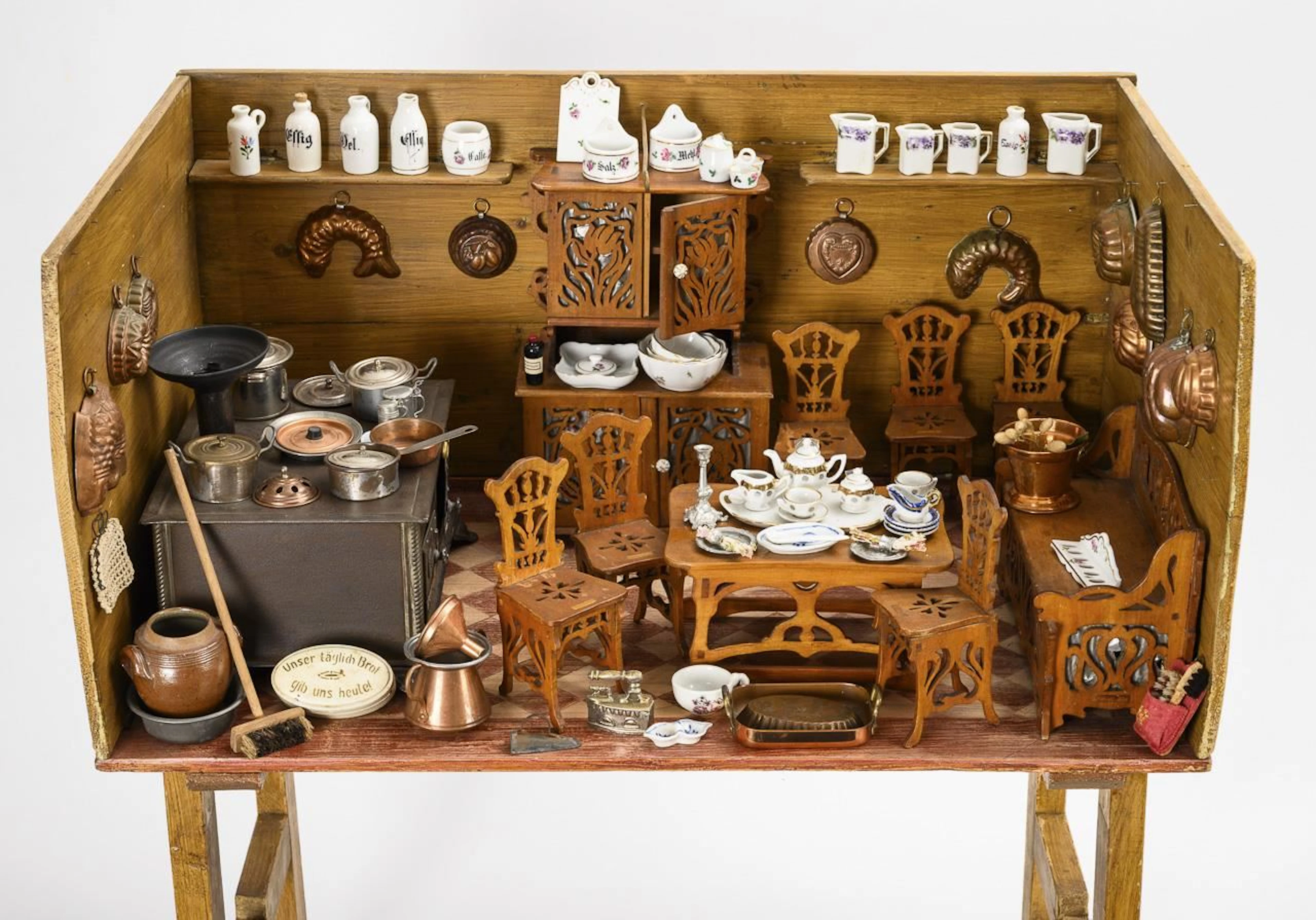 Large dollhouse kitchen with fretsaw furniture.