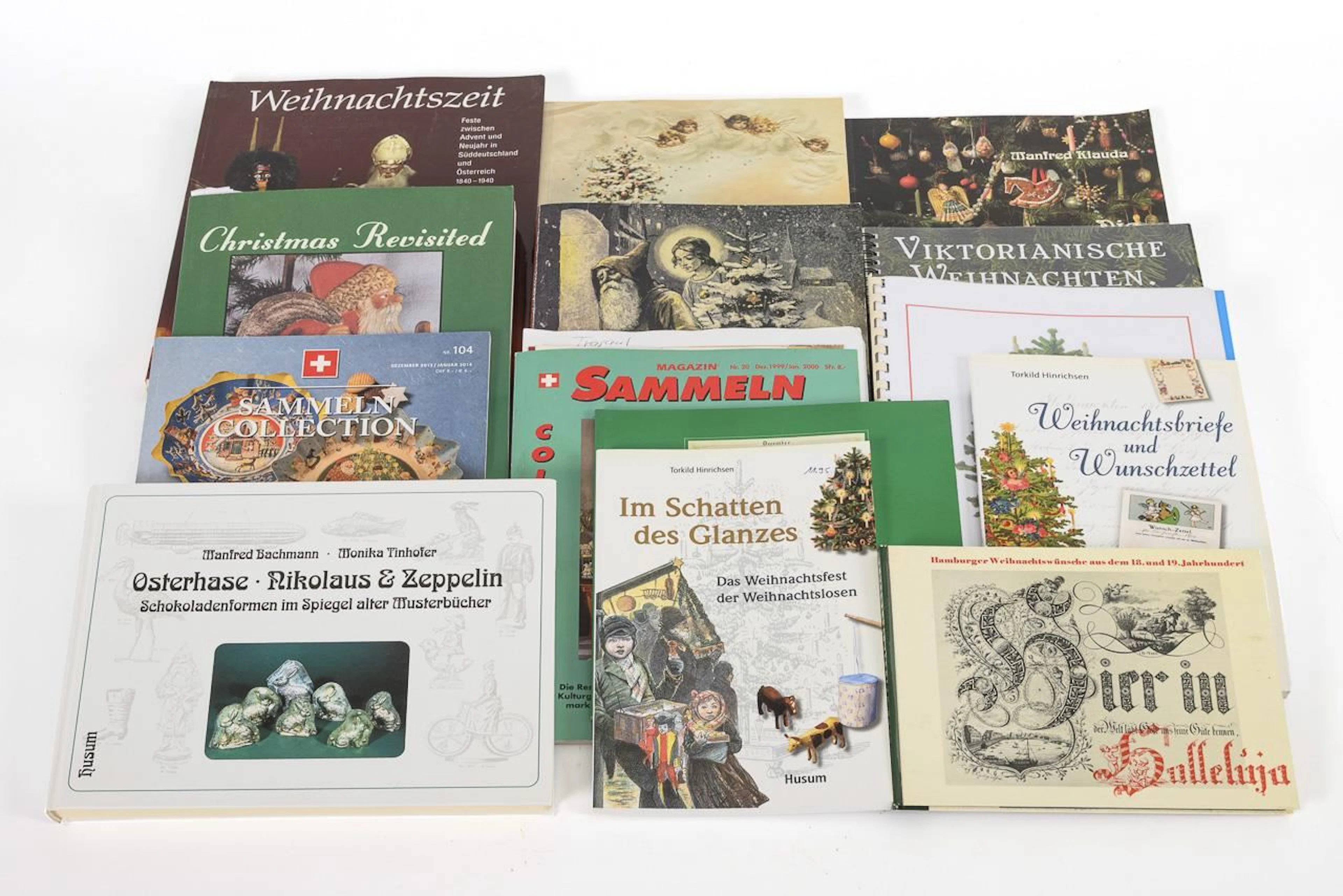 A collection of 12 books on the topic of Christmas, plus 2 issues