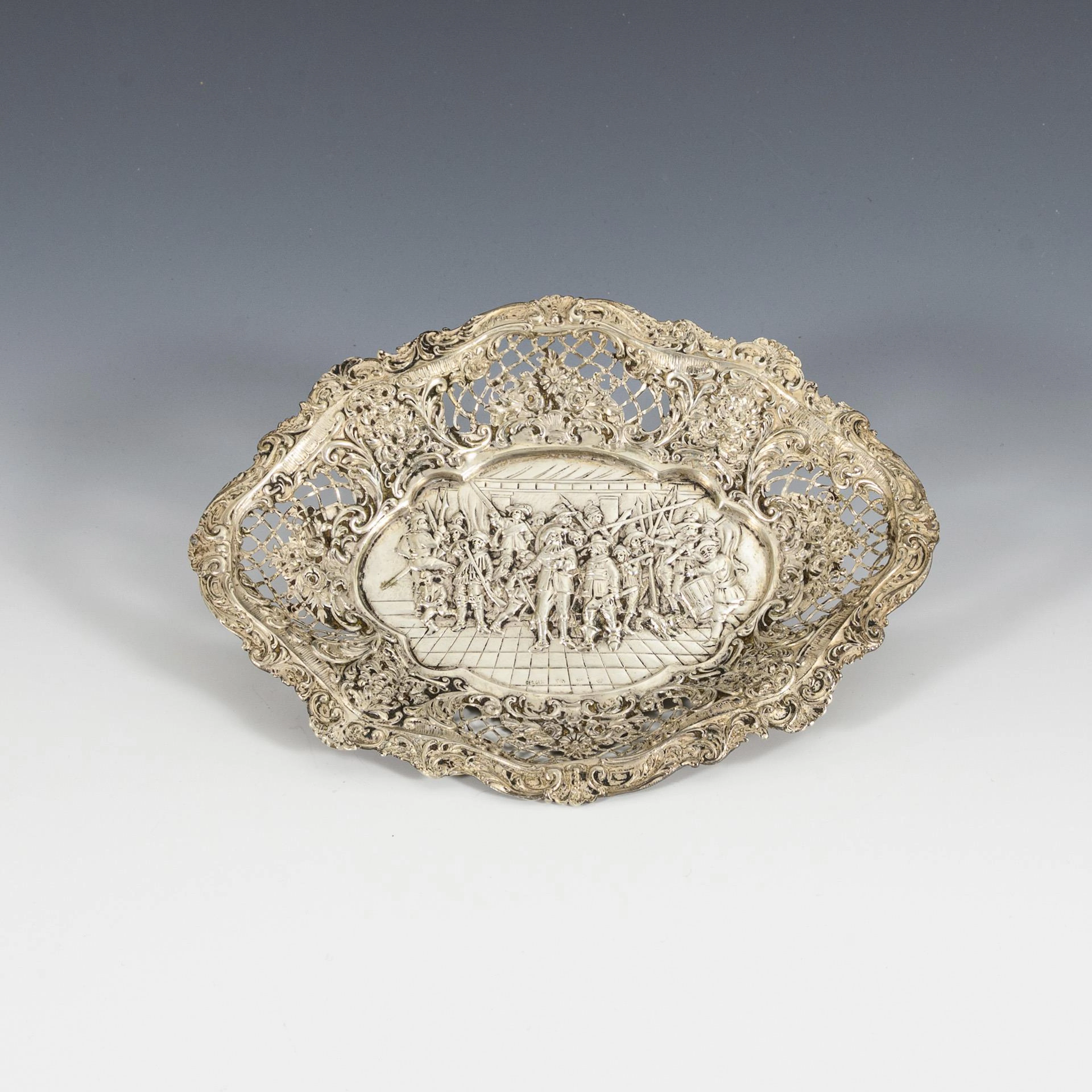 Silver bowl with figurative relief.
